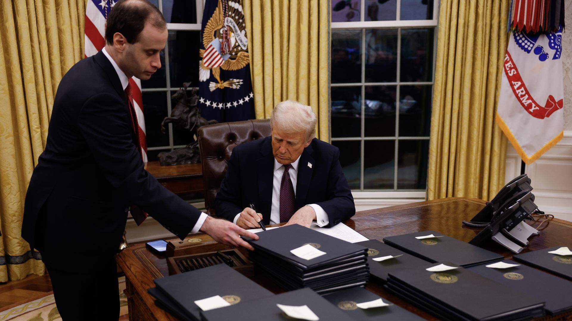 President Trump signing executive orders.