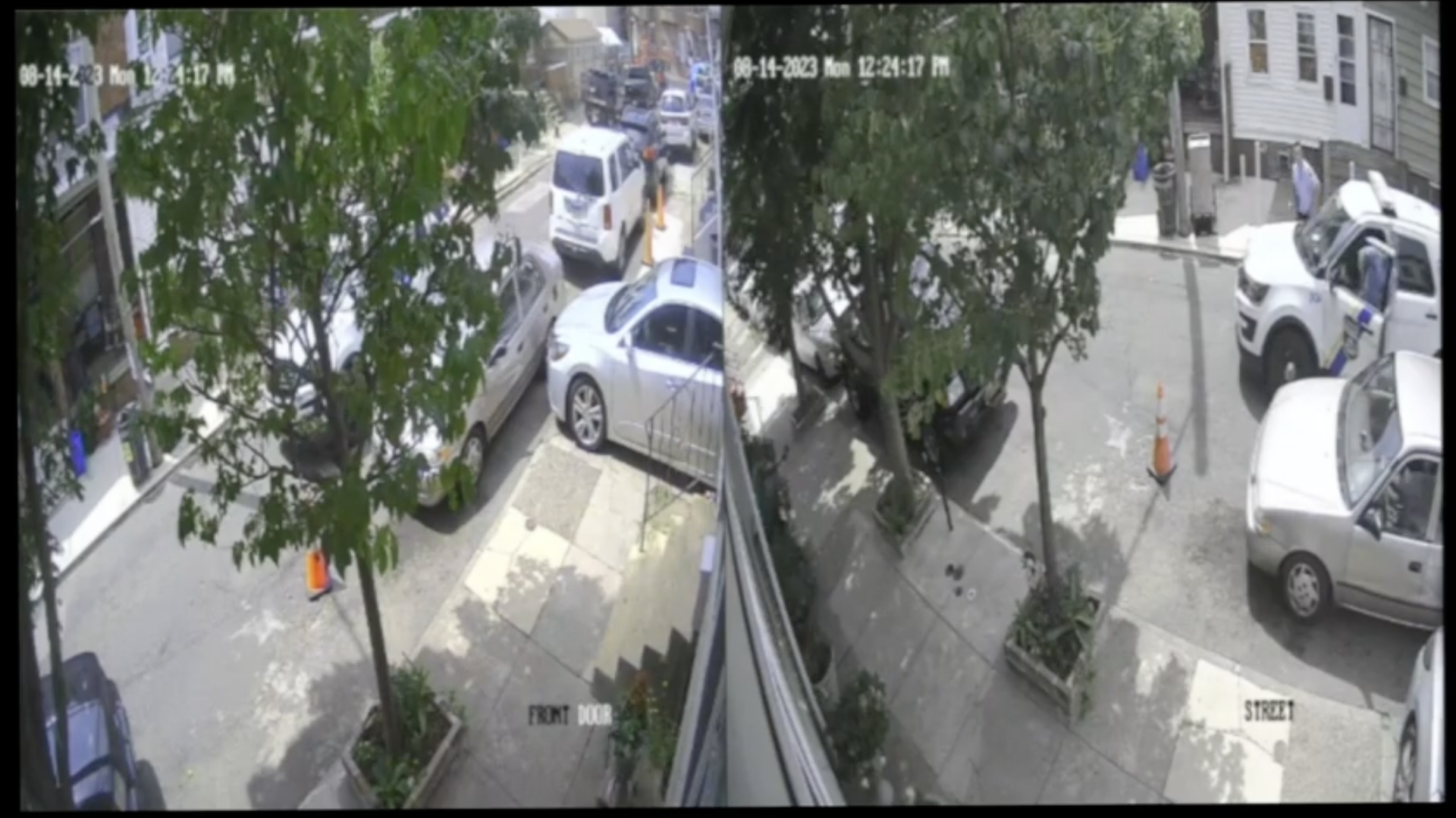 A screenshot of Ring doorbell camera footage of two police officers exiting a patrol cruiser on a street.