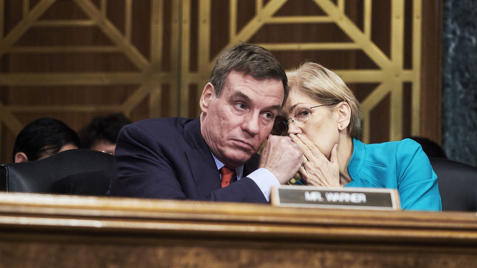 Senators Mark Warner and Elizabeth Warren.
