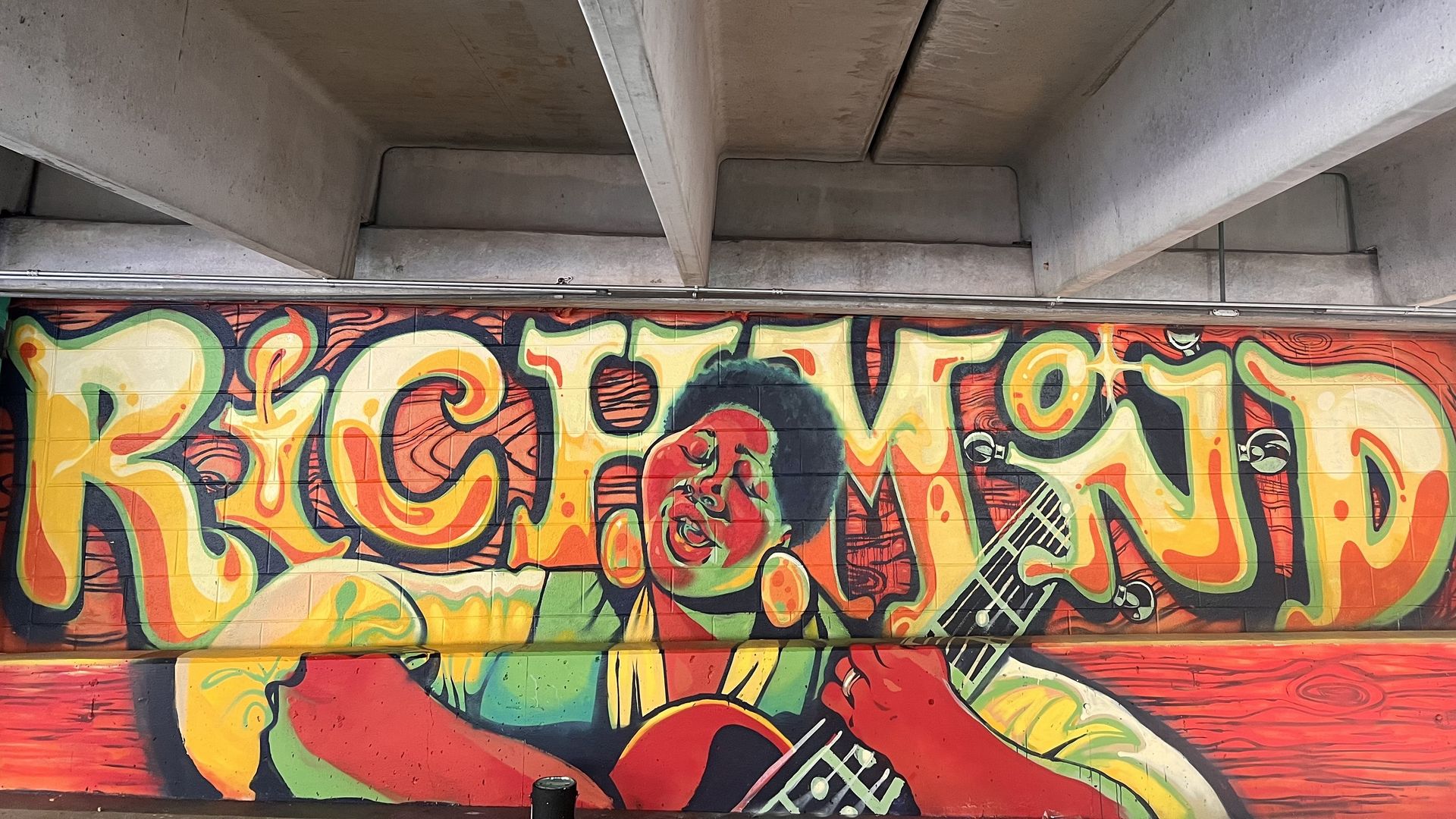 A mural with the words "Richmond" and a woman playing an instrument with her eyes closed