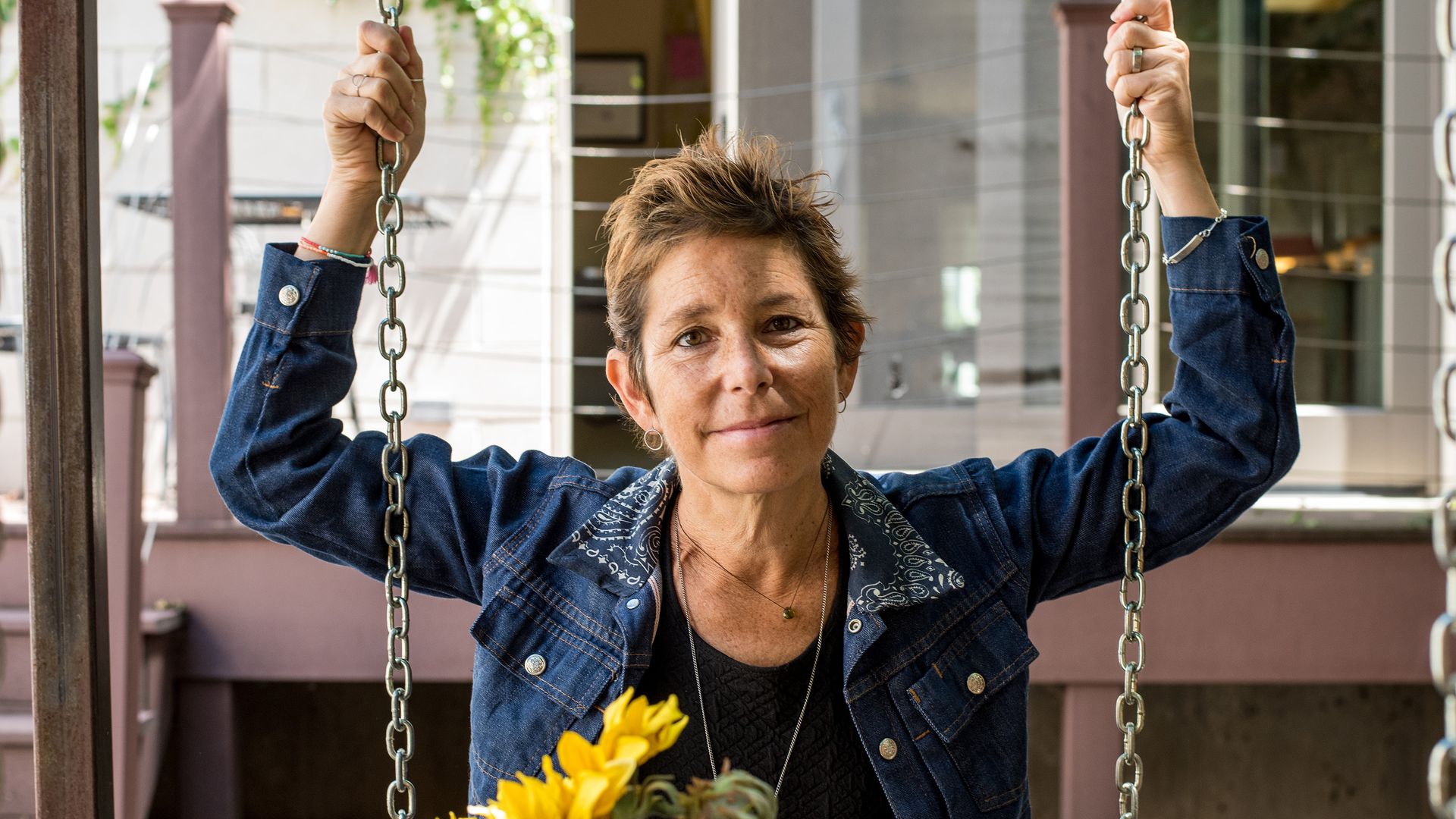 Woman on a swing with flowers