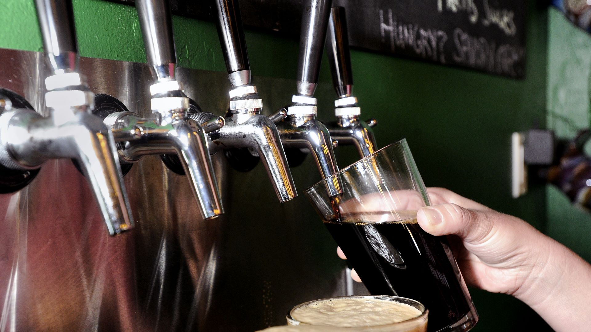 Beer pouring from a tap. Photo: Jeremy Papasso/Boulder Daily Camera via Getty Images