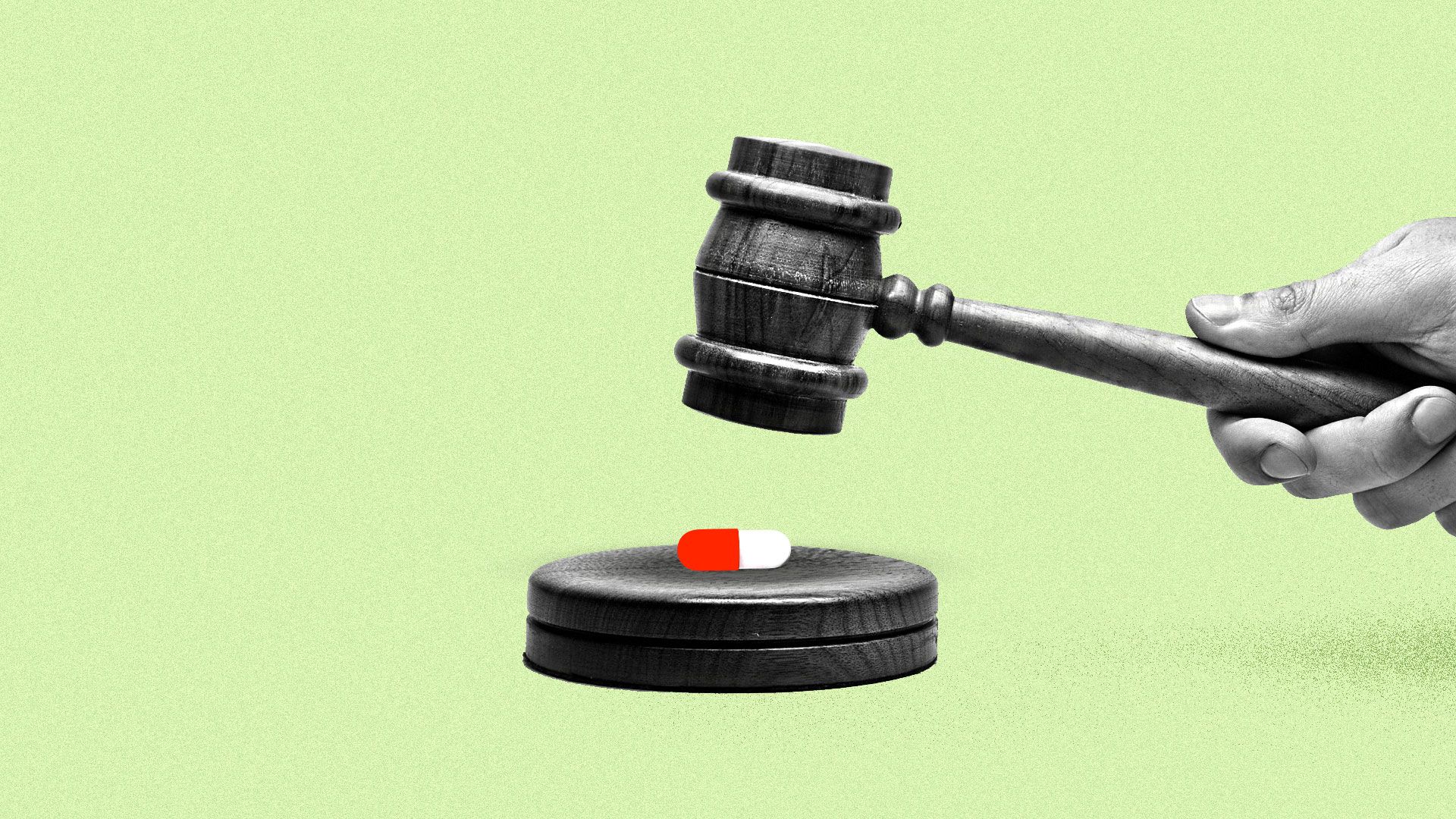 A judge's gavel about to crush a red and white pill