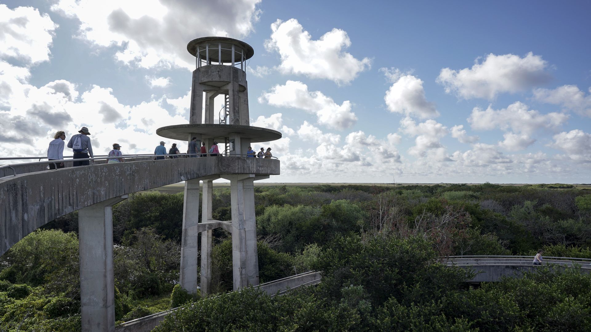 MIAMI, FL - FEBRUARY 3: Visitors take in a view of the landscape from the Shark Valley Observation Tower in Everglades National Park on February 3, 2023 in Miami, Florida. The tower was constructed as part of the Mission 66 program to develop facilities for visitors. (Photo by Bonnie Jo Mount/The Wa