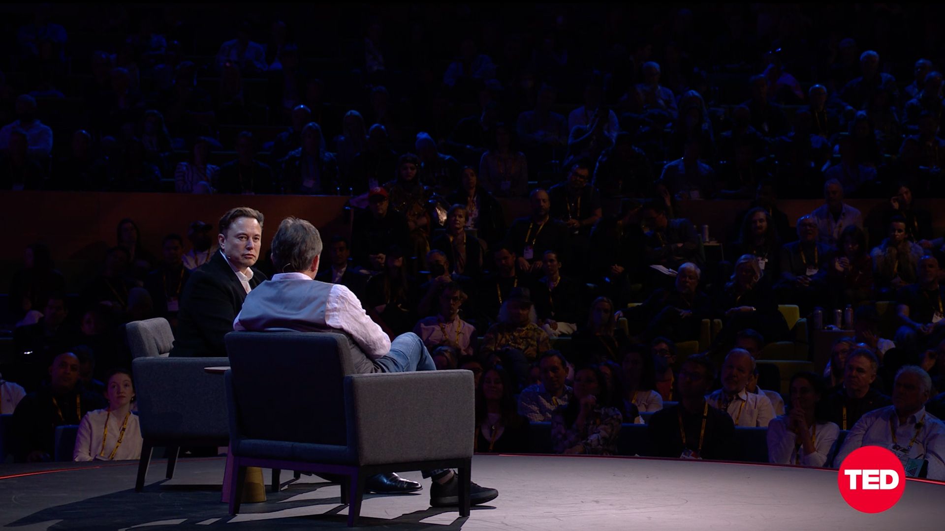 Elon Musk on stage in front of crowd