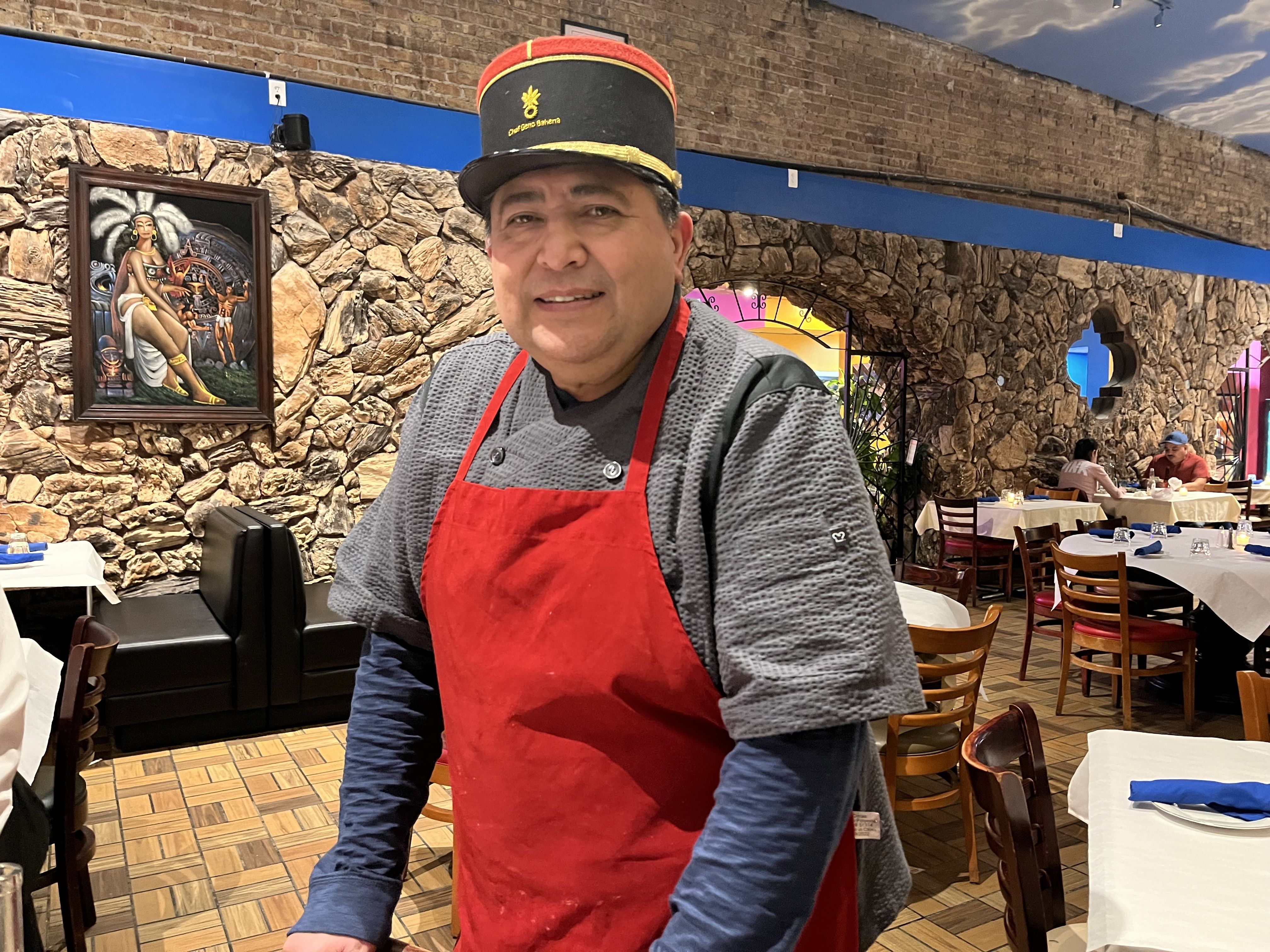 man in a red apron