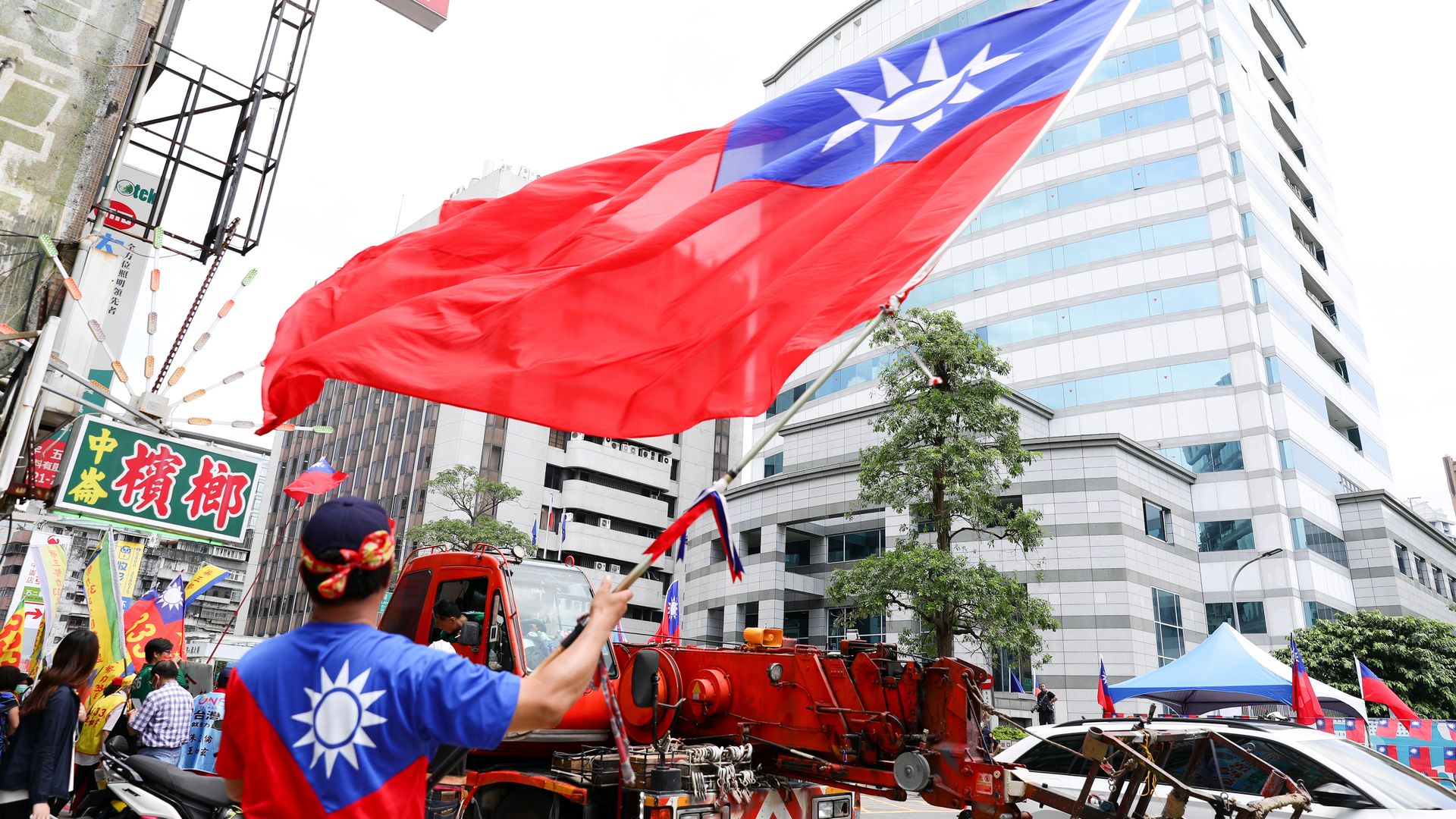 A supporter of the Kuomintang party waves a Taiwanese flag in Taipei, Taiwan, on Wednesday, May 17, 2023.