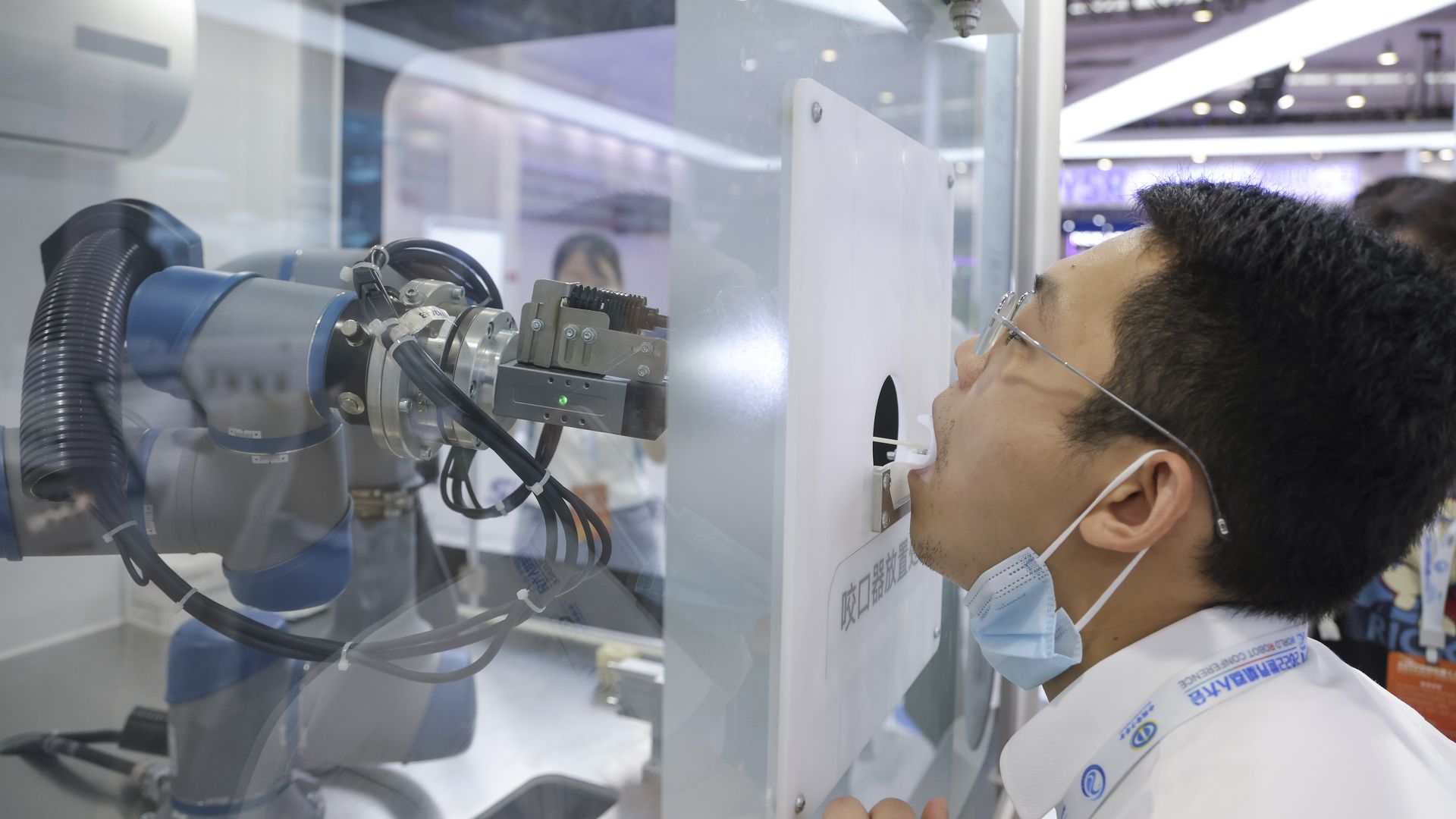 A robot performs a COVID test at the 2022 World Robot Conference in Beijing, China.