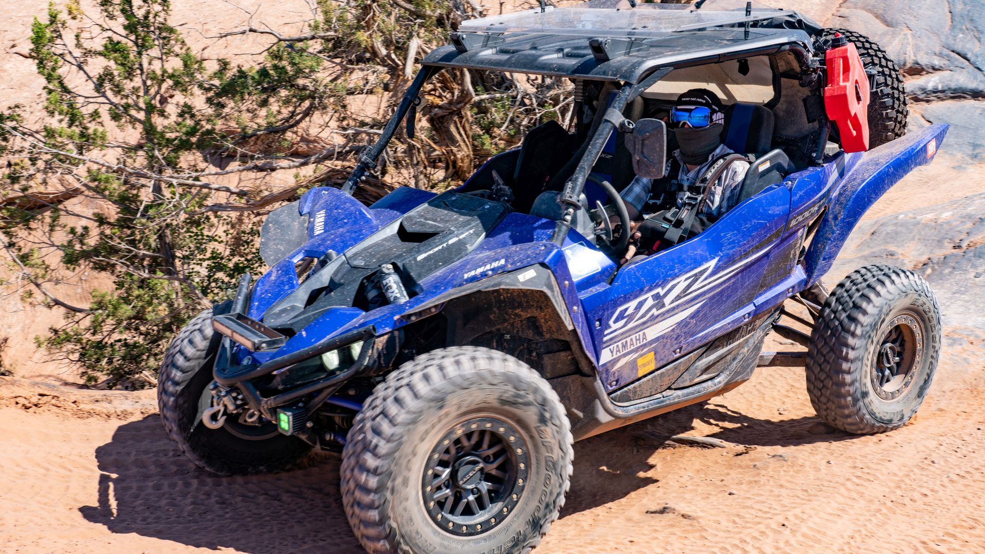 A UTV on a desert trail.