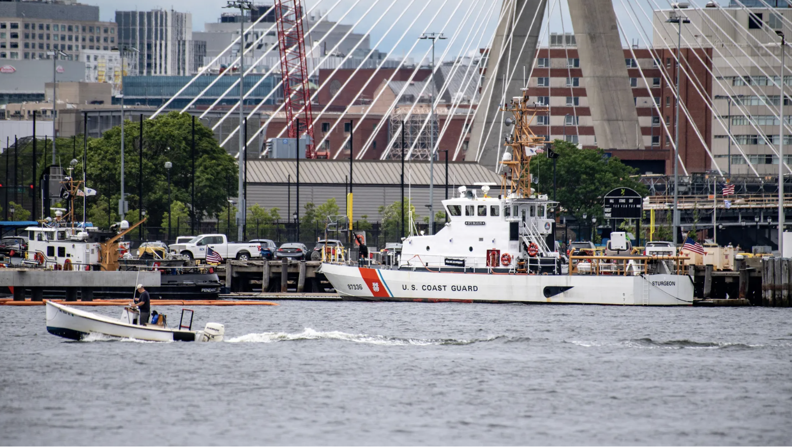 A U.S. Coast Guard vessel sits in port on Monday in Boston Harbor across from the U.S. Coast Guard Station Boston in Boston, Massachusetts, which is leading the search for the missing submersible craft. 