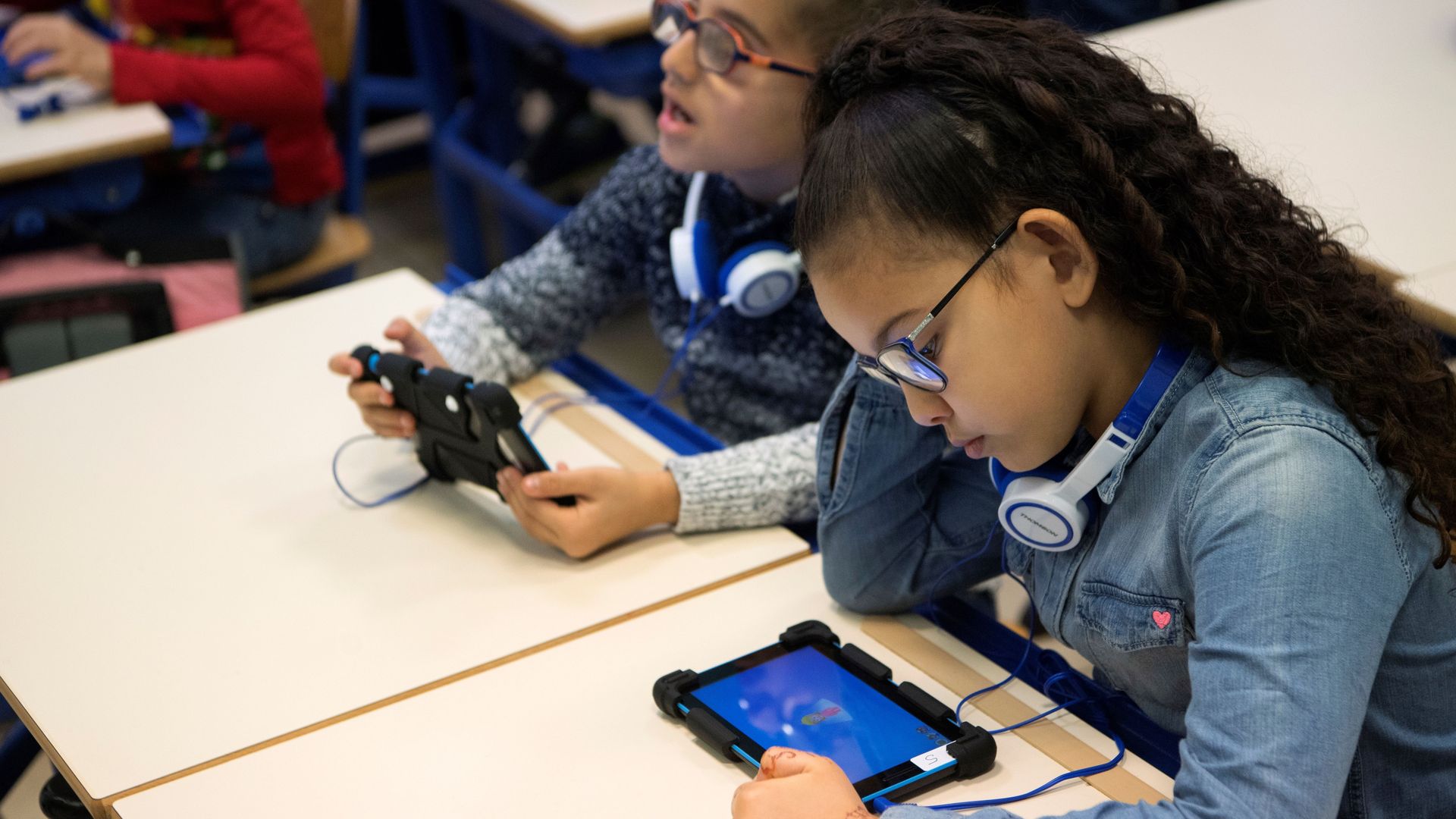 School children using a tablet