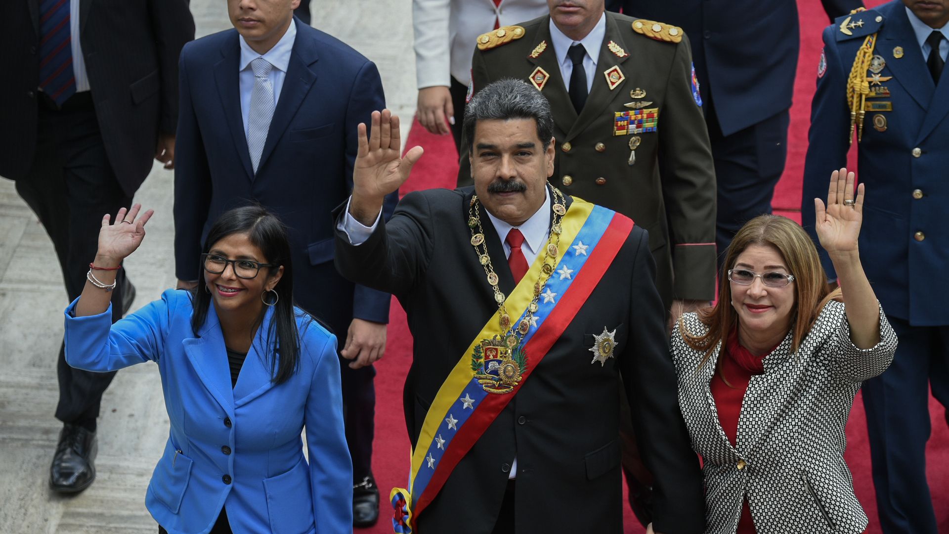 Maduro and wife and other officials waving