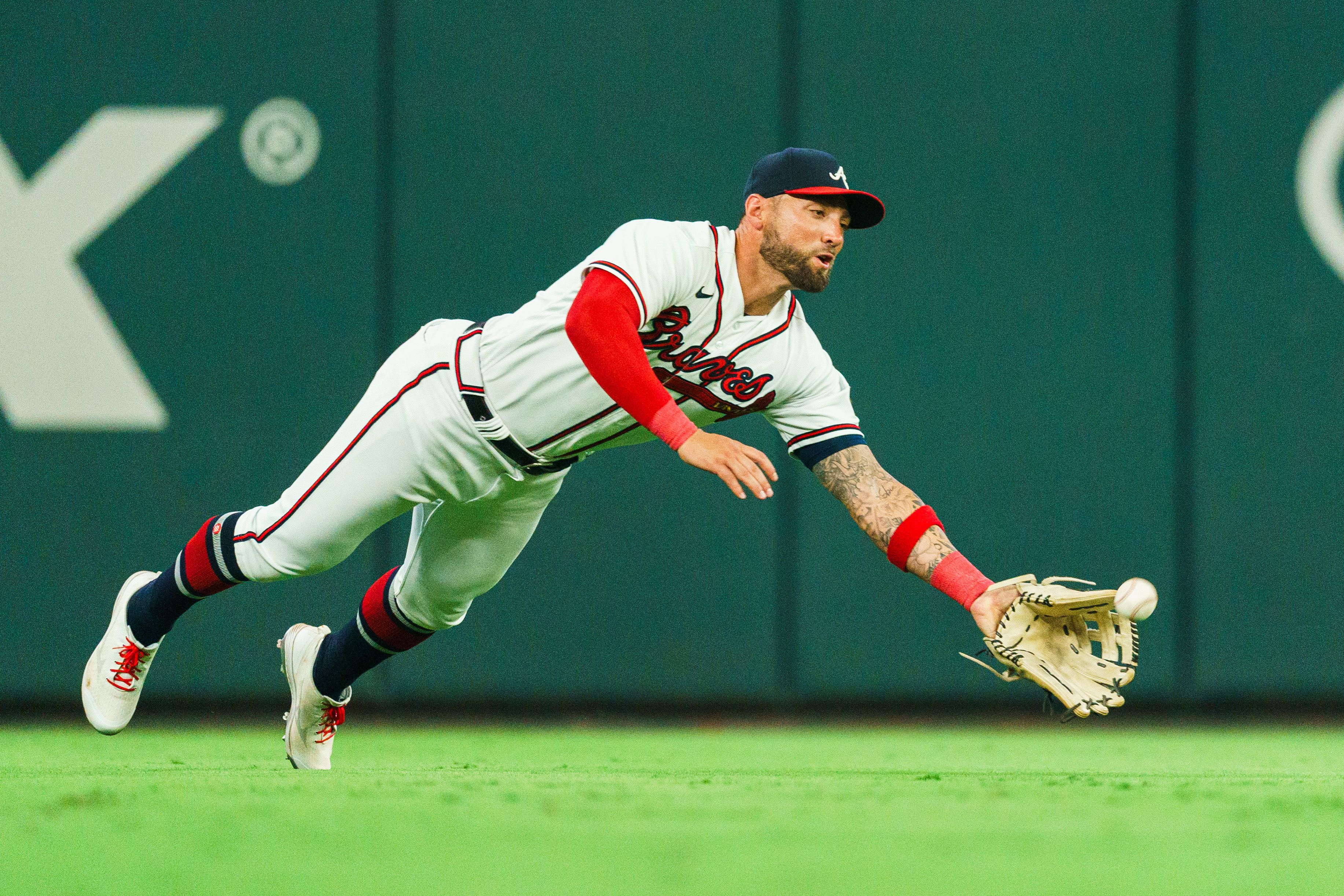 Photo of a baseball player diving 