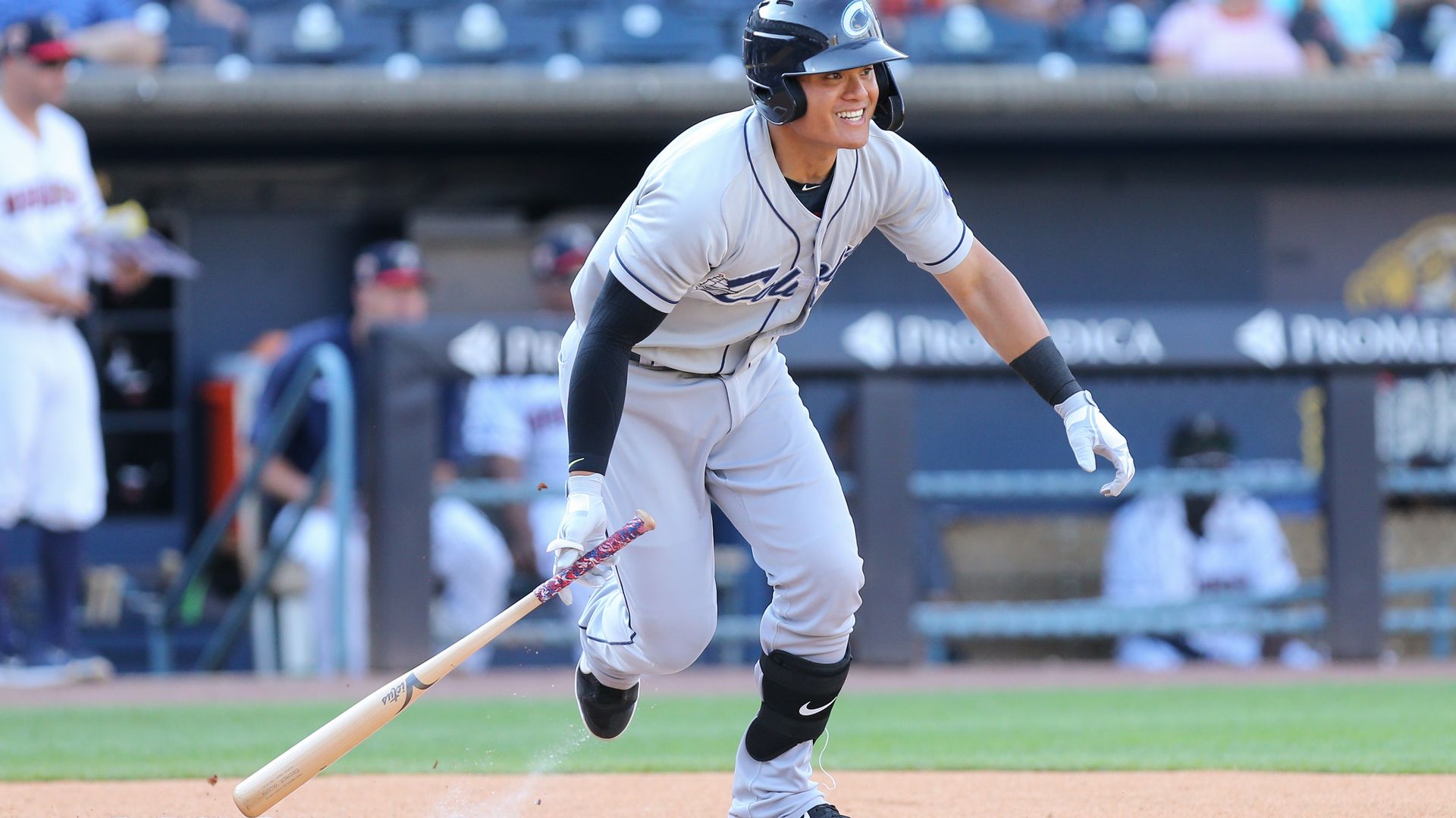 Columbus Clippers player Yu Chang drops his bat after a swing.