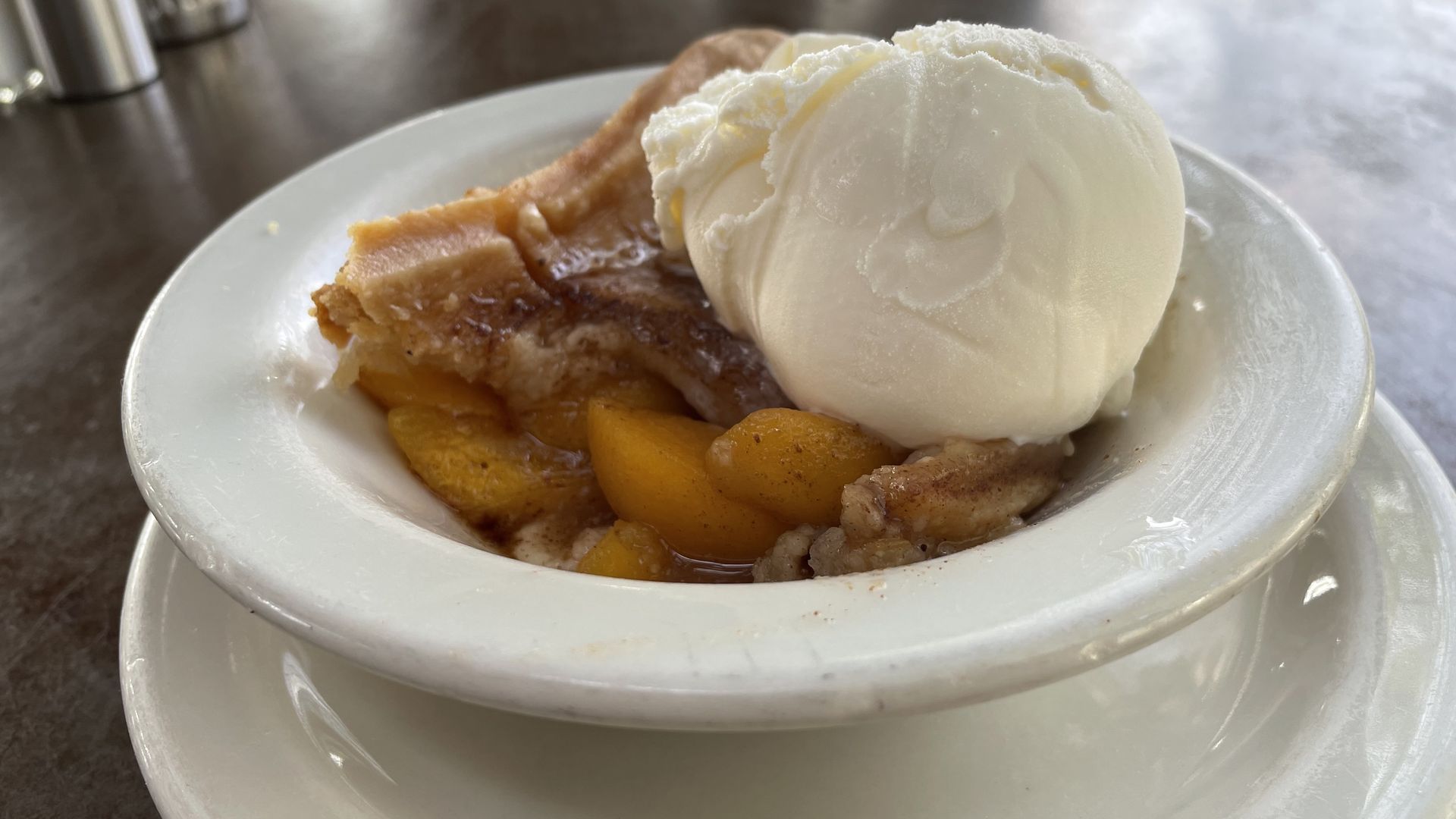 Peach cobbler with ice cream