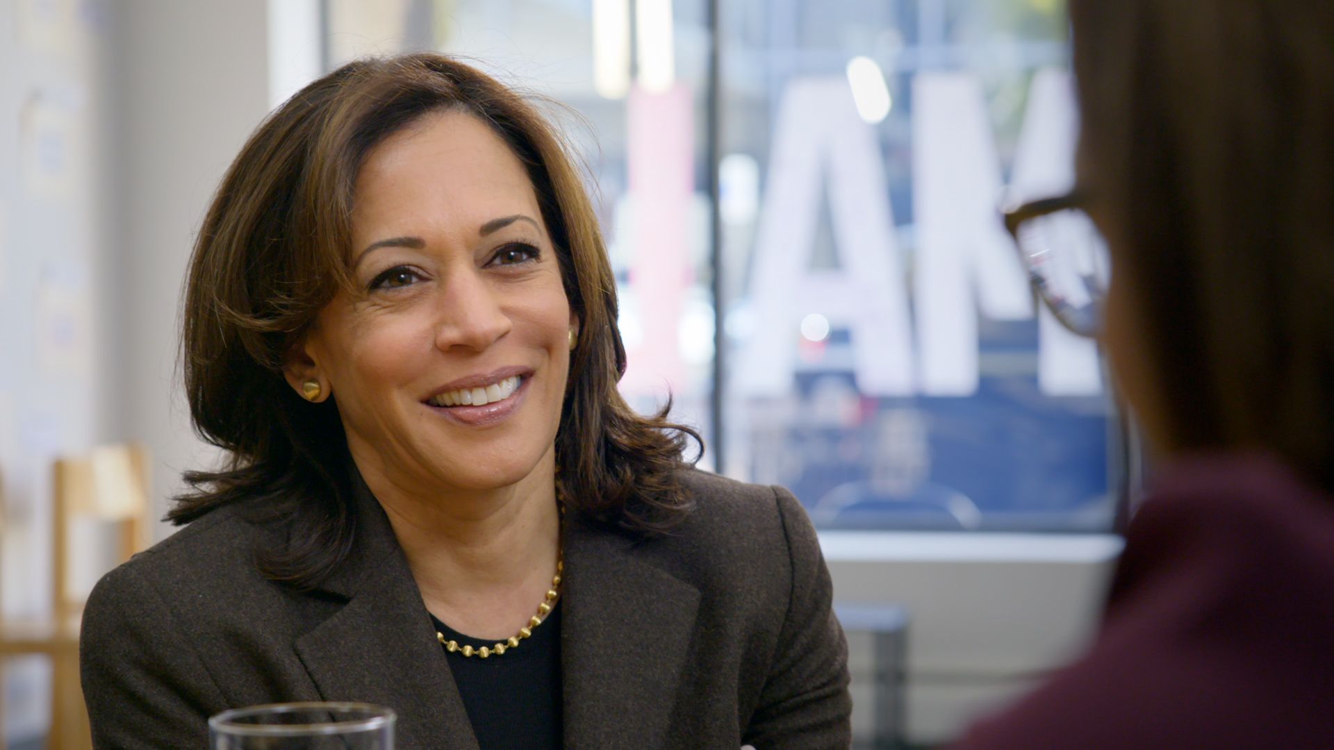 Kamala Harris smiles as she gives an interview