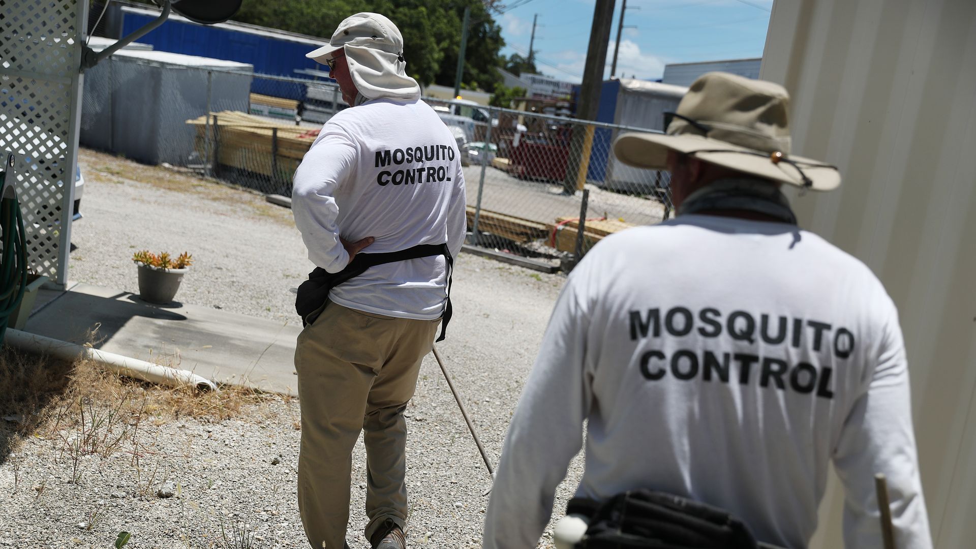 Members of the Florida Keys mosquito control department inspecting a neighborhood in Key Largo in July 2020.