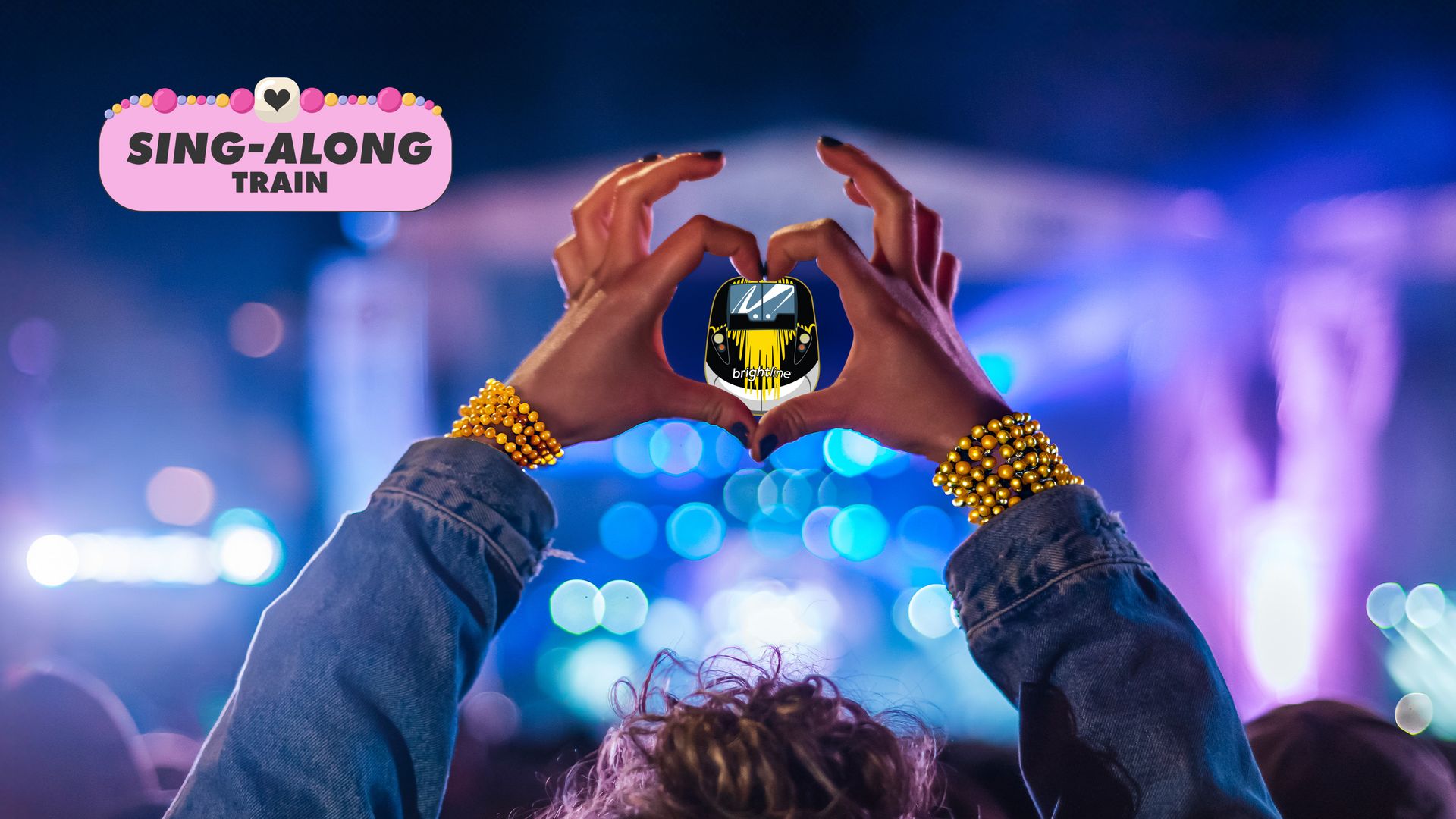 Words "Sing-along train" at top of photo of a two hands making a heart shape with an image of train in the heart.