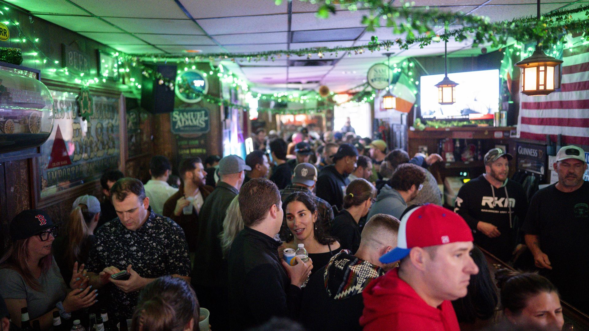 Patrons enjoy the last night of Sligo Pub, a dive bar in Davis Square. 