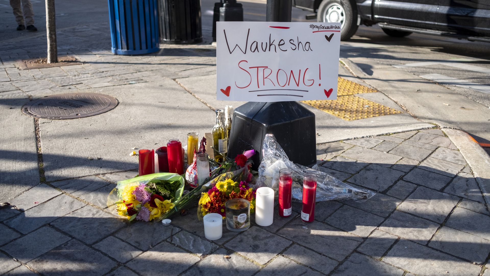 Memorials placed  in downtown Waukesha Wisconsin left in areas where people were hit by a driver plowing into the Christmas parade on Main Street in downtown November 22, 2021 in Waukesha, Wisconsin. 