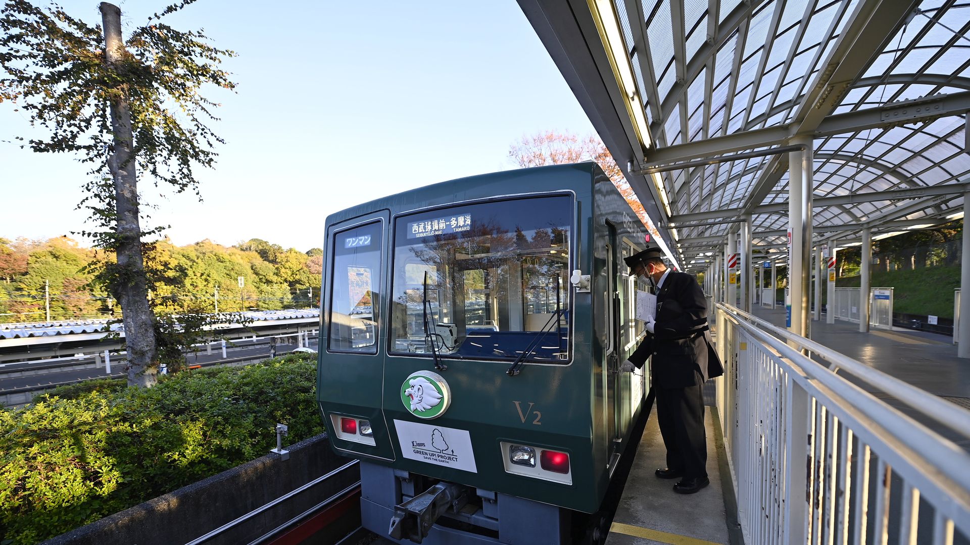 A railway worker inspects a solar-powered train in Japan.