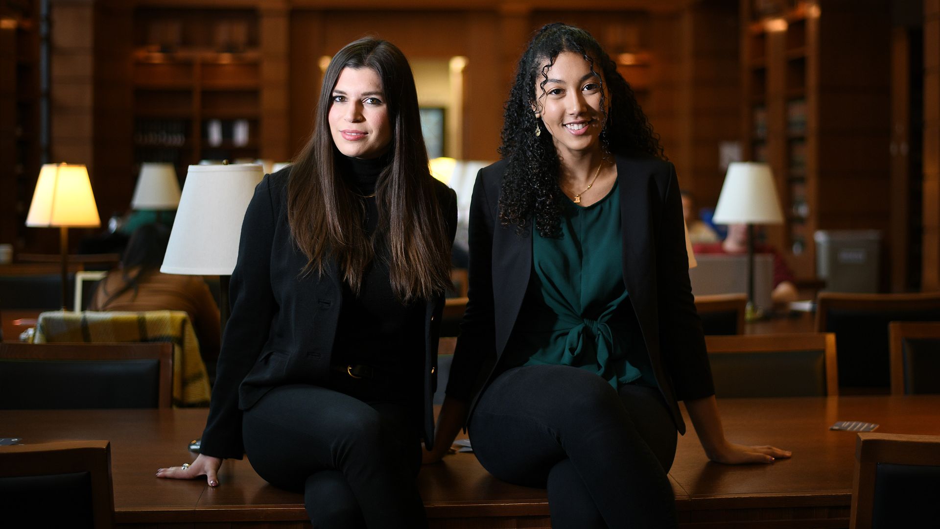 Grace Paras and Toni Deane pose for portrait photographs at Georgetown Law Center 