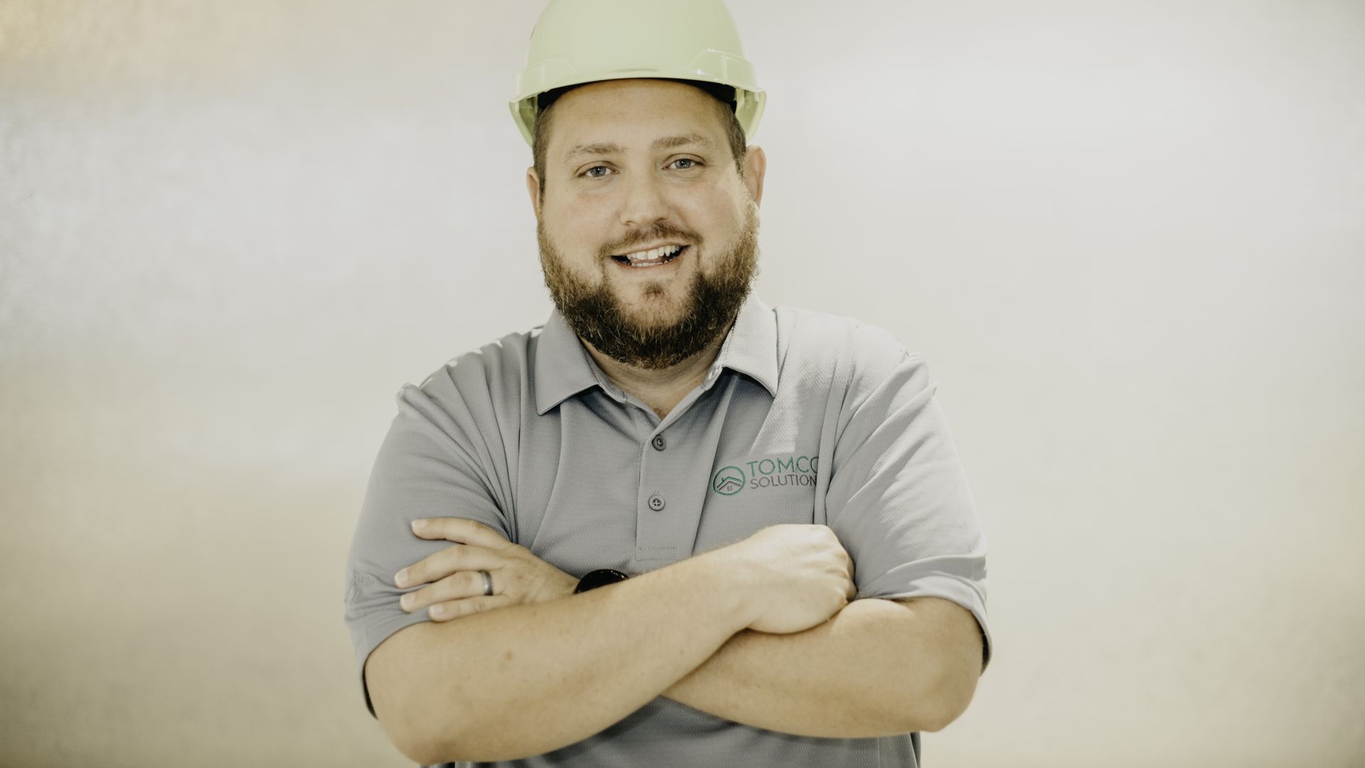 Tommy Whitehead, arms crossed wearing a hard hat