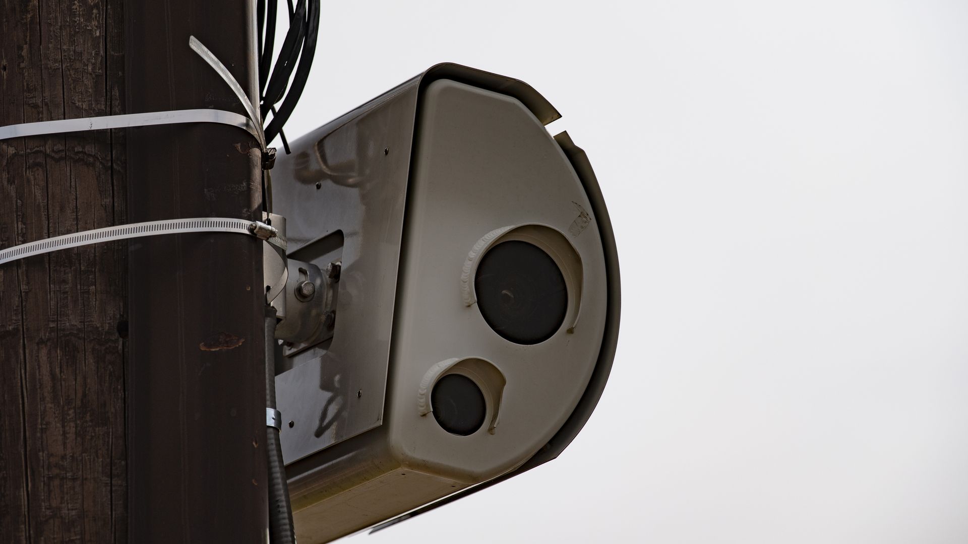 A speed camera posted on a pole