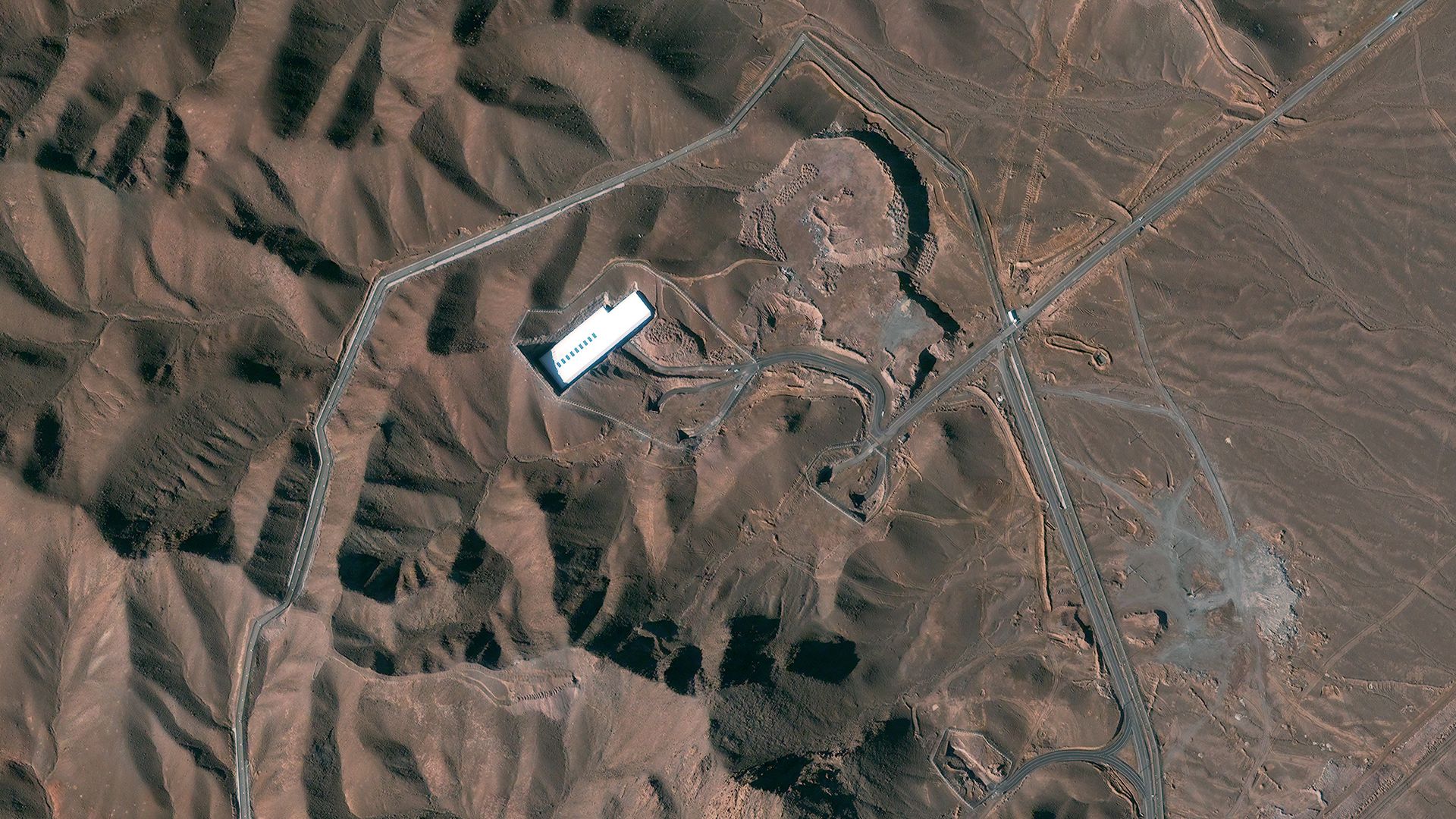 satellite of brown ground white building