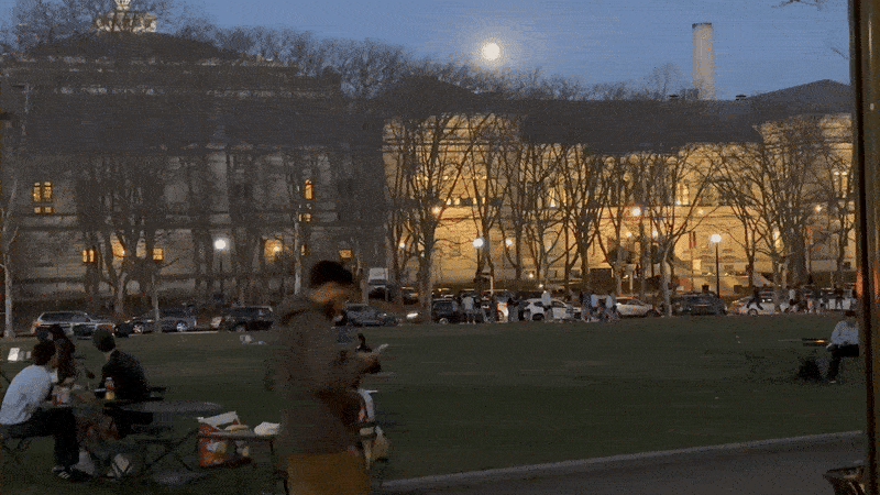 People walking, biking and lounging in Pittsburgh's Schenle y Plaza on a warm spring evening