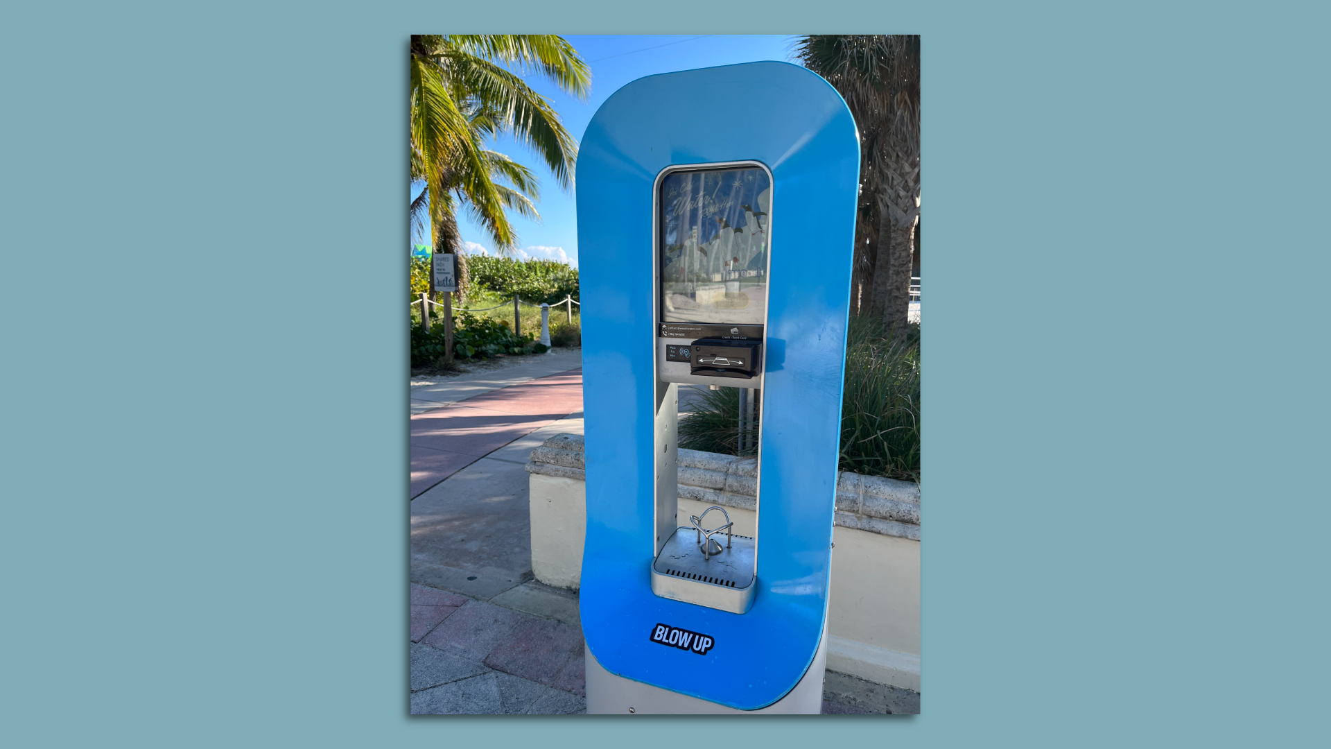 A Woosh water-dispensing station, which required a credit card purchase, is seen on the Miami Beach beachwalk.