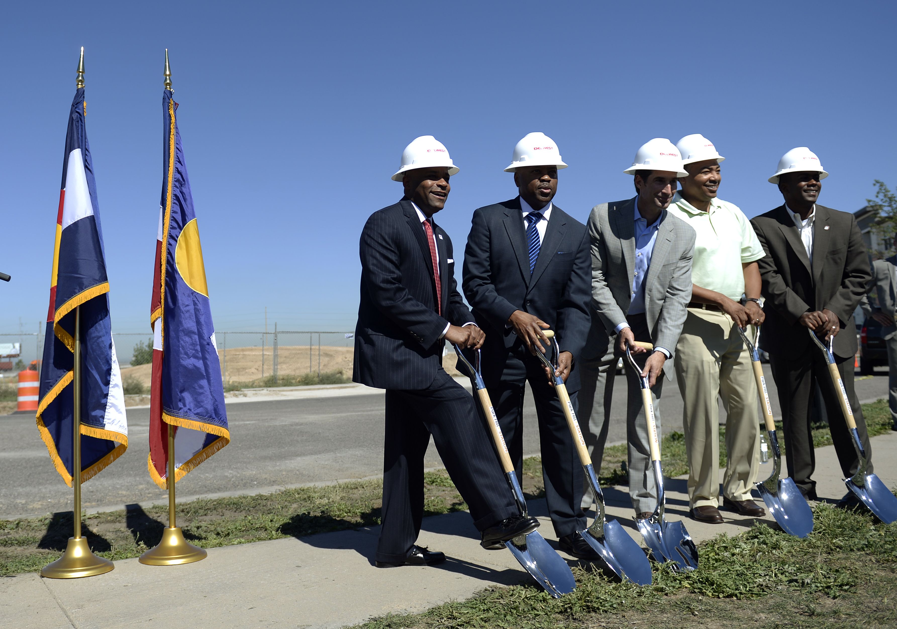 DENVER, CO. SEPTEMBER 18: Denver Mayor Michael Hancock, far left, was joined by left to right: Phil Washington, RTD general manager, Joe DelZotto, president and CEO of Delwest, Paul Washington, executive director of the Denver Office of Economic Development, and Chris Herndon, from Denver City Council, to break ground on a new affordable housing apartment complex at 40th Ave. and Colorado Blvd. in Denver on Thursday, September 18, 2014. The project called Park Hill Station will offer 156 unit of affordable housing and be connected to light rail. (Denver Post Photo by Cyrus McCrimmon)