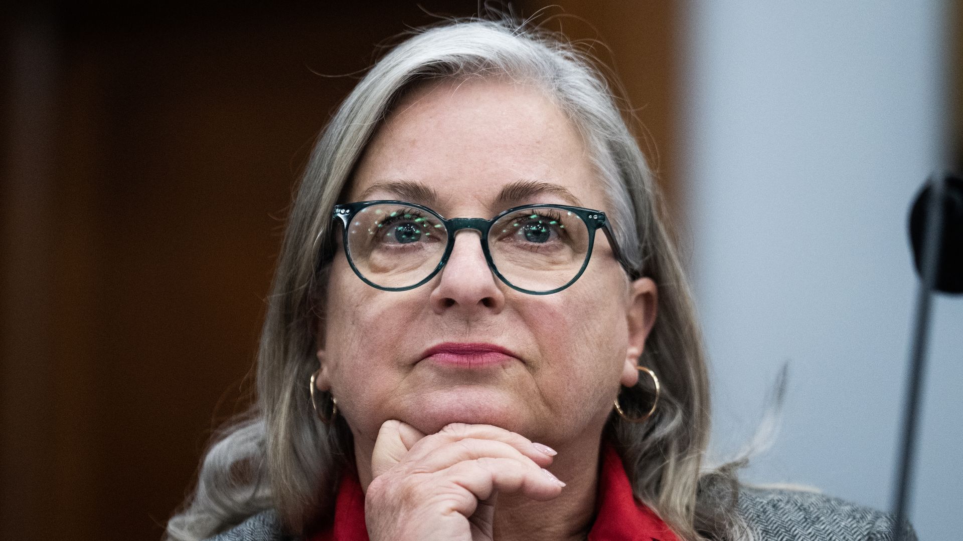 Rep. Susan Wild, wearing a gray suit with her hand on her chin.