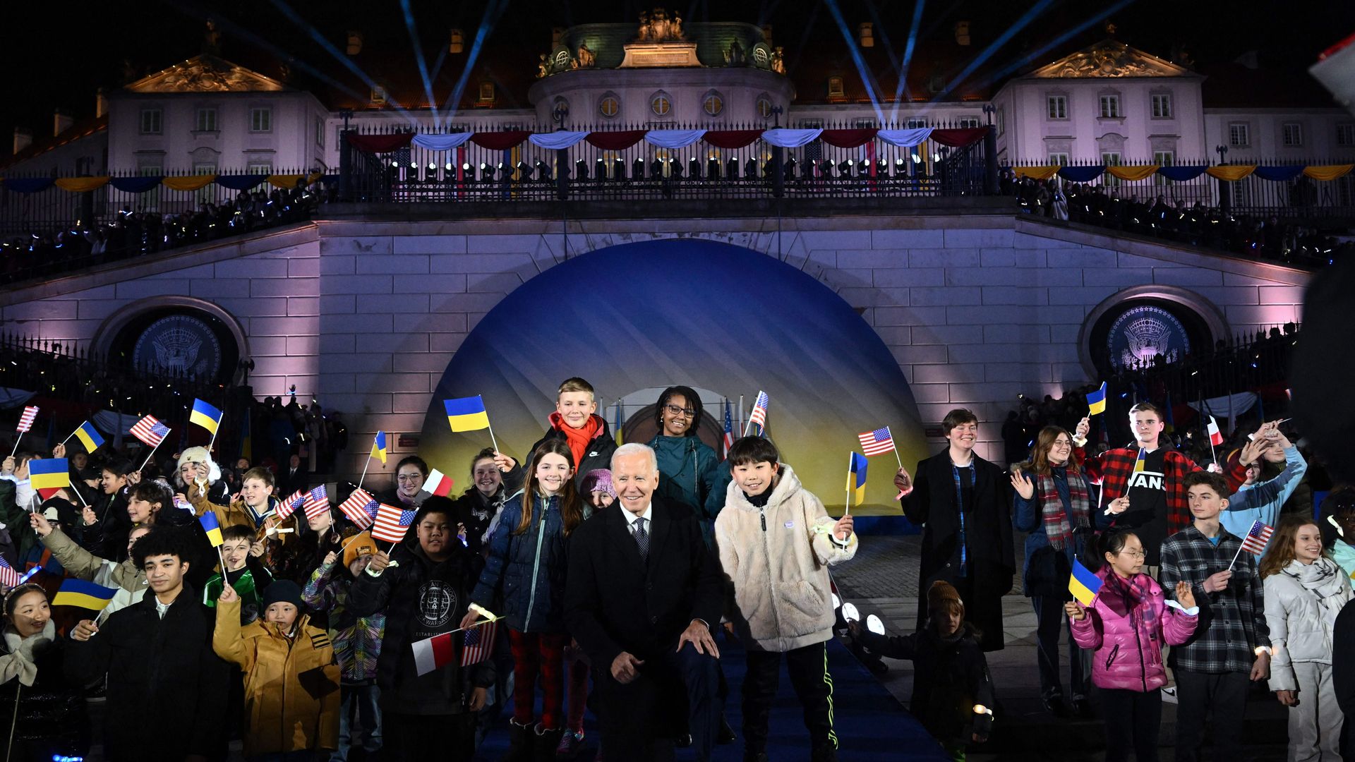 Biden poses with children after delivering a speech at the Royal Warsaw Castle Gardens in Warsaw, Poland. Photo: Mandel Ngan/AFP via Getty Images