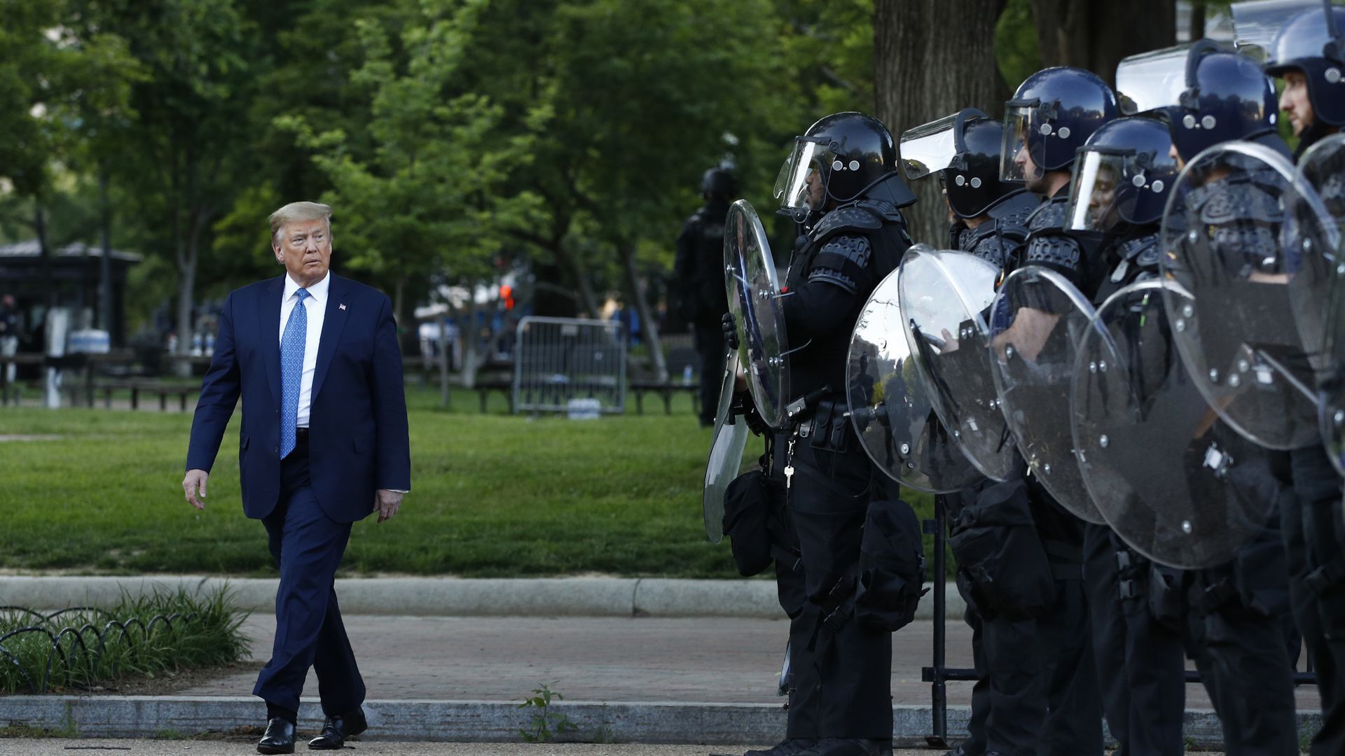 Trump walking past police