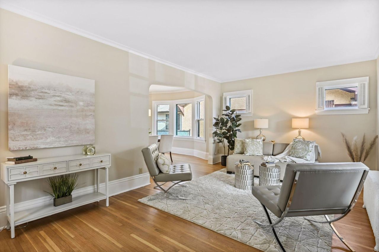 sunny living area with view of dining area