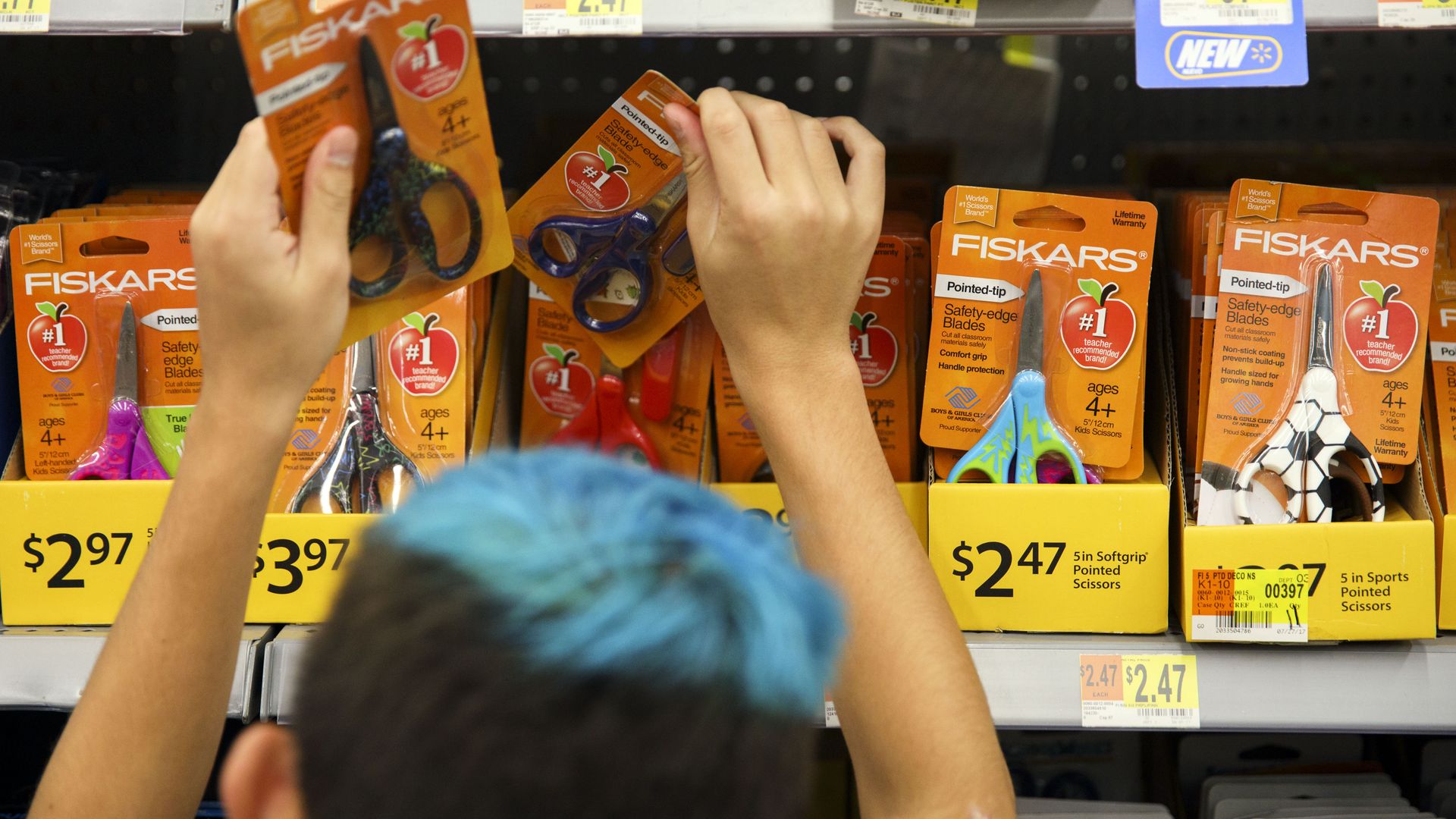 Kid with blue hair reaching for scissors 