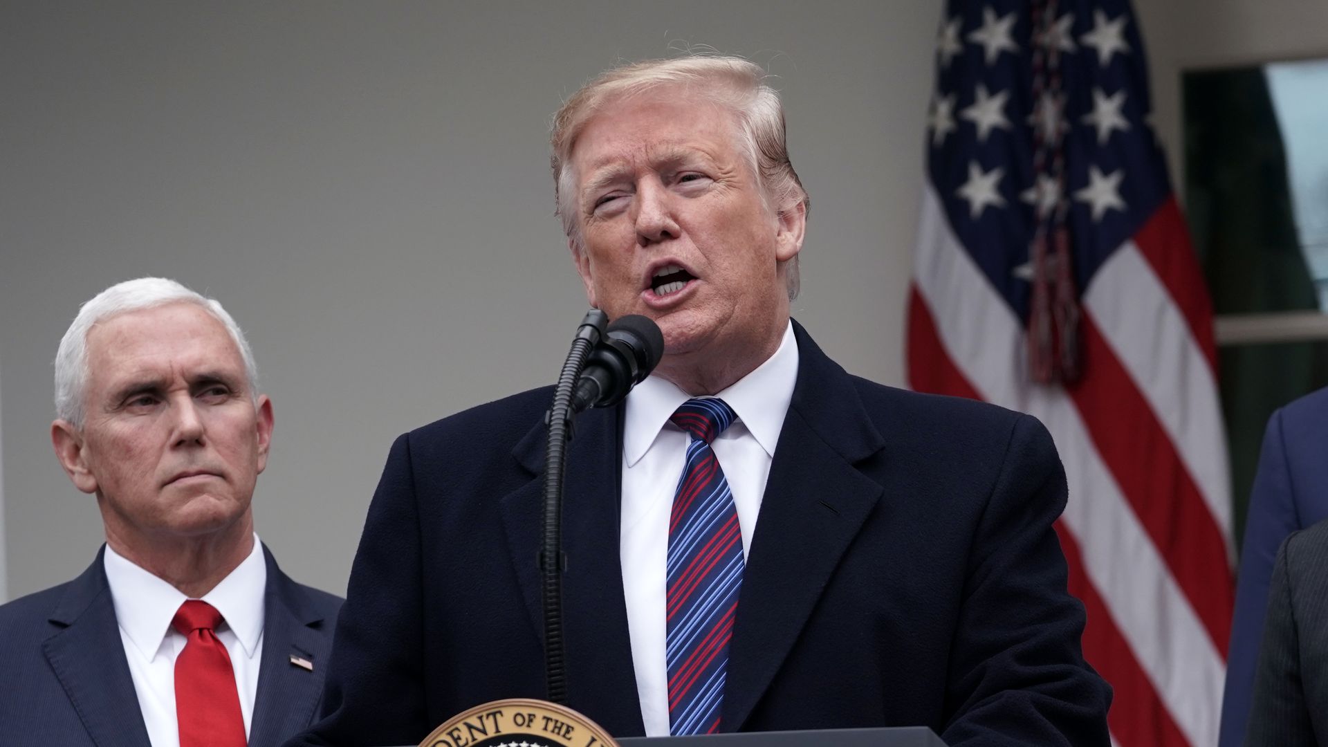 President Trump speaking in the Rose Garden, with Mike Pence standing next to him.