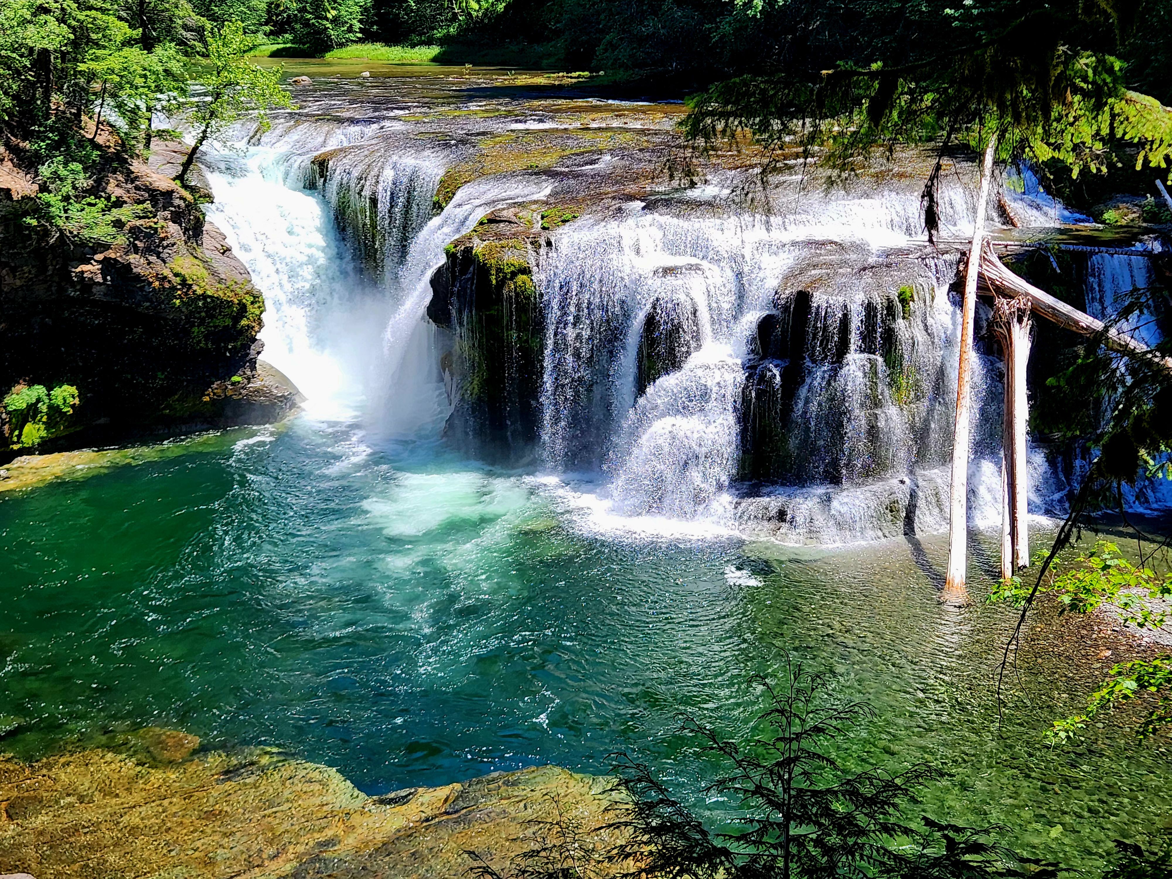 A waterfall on a blue-green river