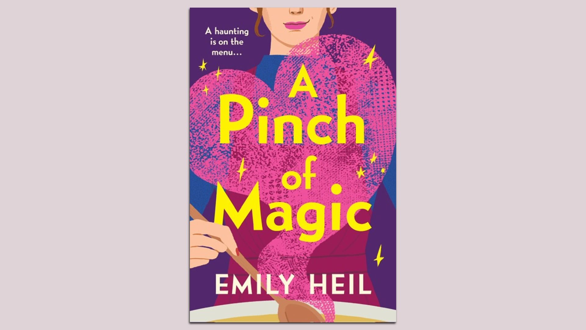 Book cover for "A Pinch of Magic" by Emily Heil. Purple background with a large pink heart, bold yellow title across, and a partial image of a woman's face at the top.