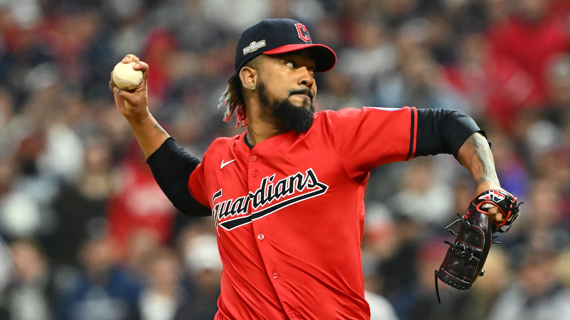 Cleveland Guardians closer Emmanuel Clase pitching in a red jersey