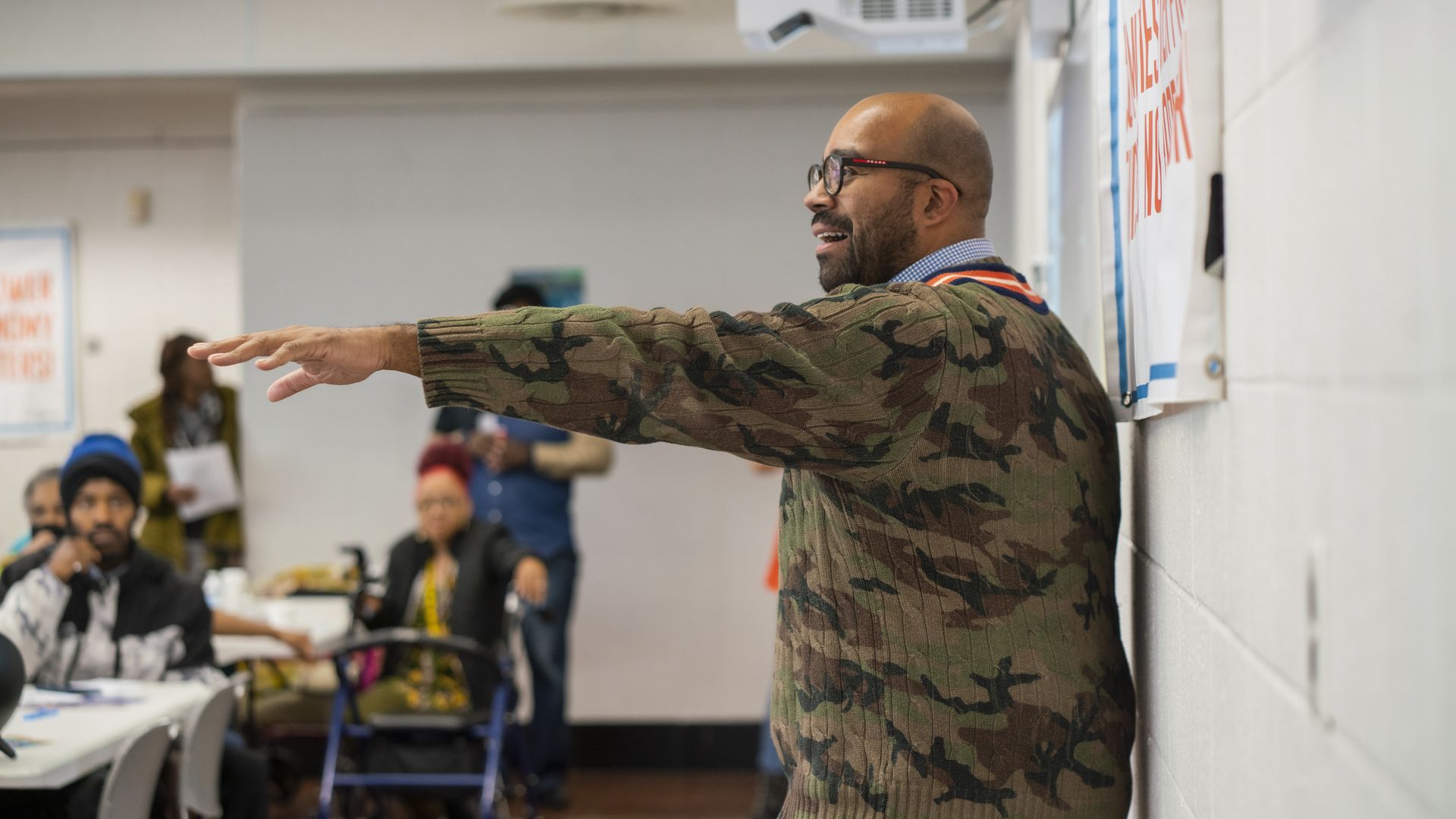 Scott Holiday is seen during an event, speaking and gesturing