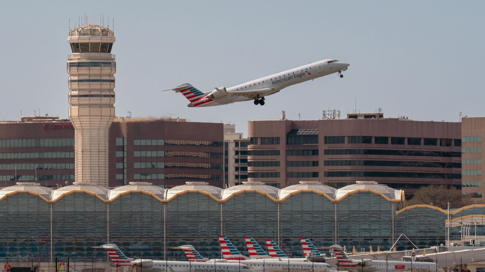A flight flying over an airport.