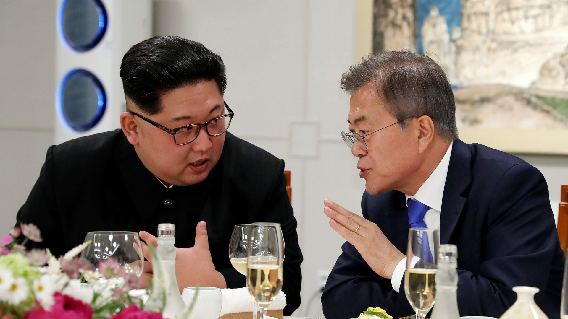 Kim and Moon at dinner table during banquet
