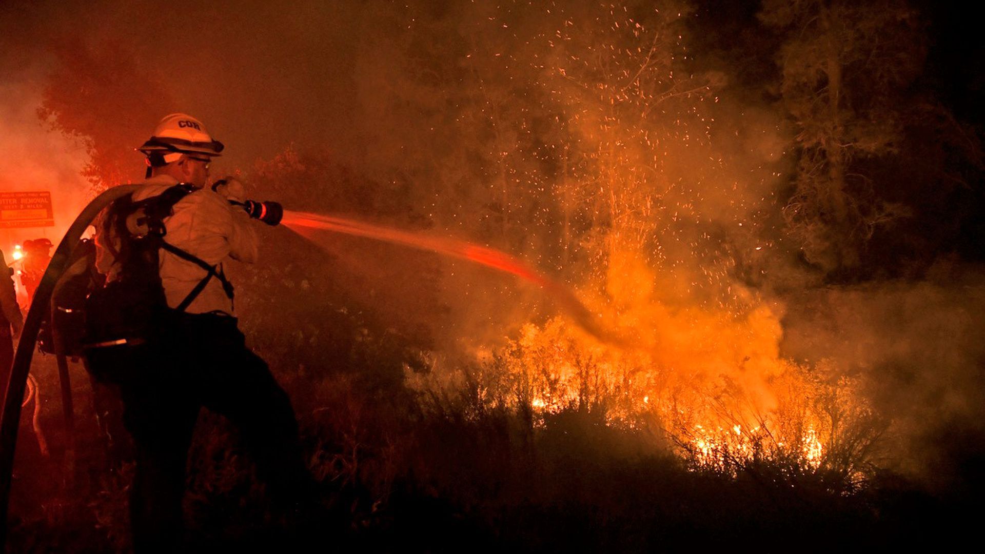 Firefighters battle the Lake Fire near Lake Hughes, California, on Aug. 15. 