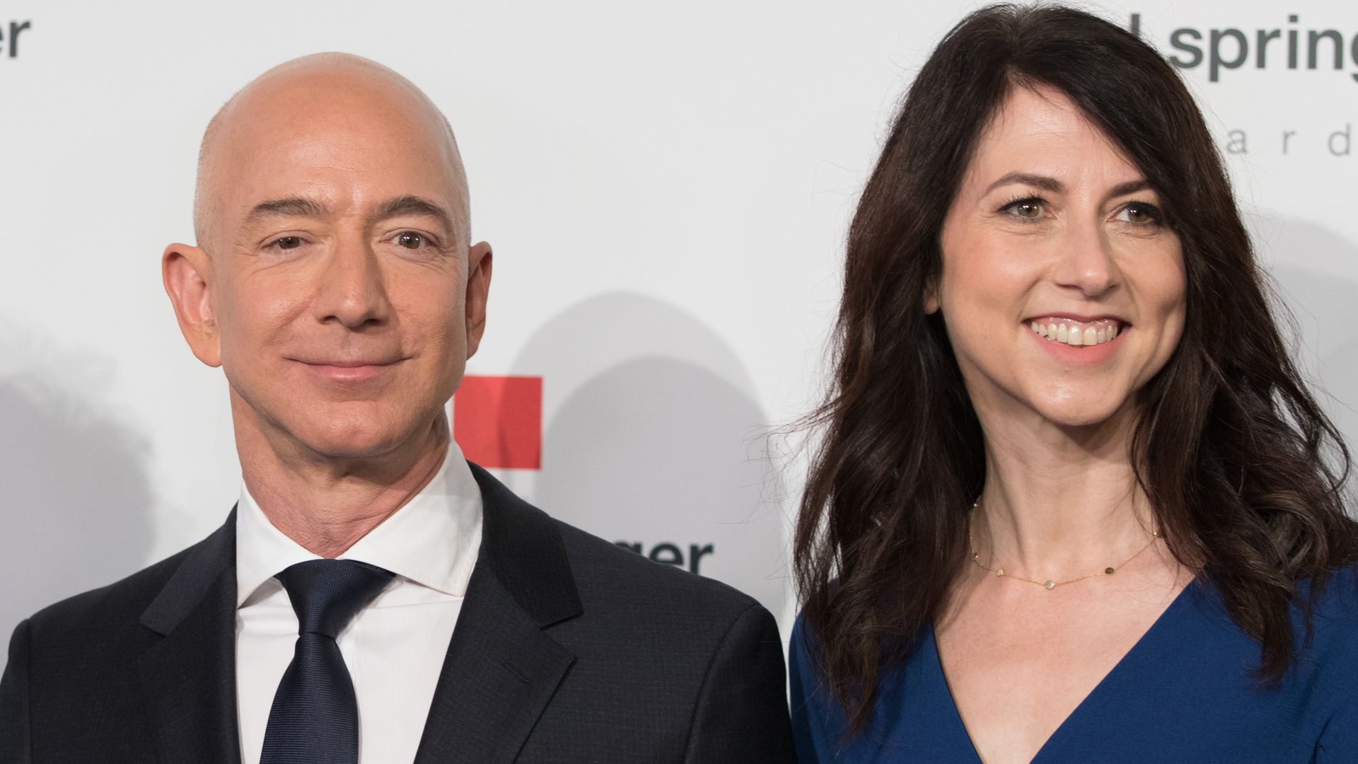 Amazon CEO Jeff Bezos and his wife MacKenzie Bezos poses as they arrive at the headquarters of publisher Axel-Springer where he will receive the Axel Springer Award 2018 on April 24, 2018 in Berlin.