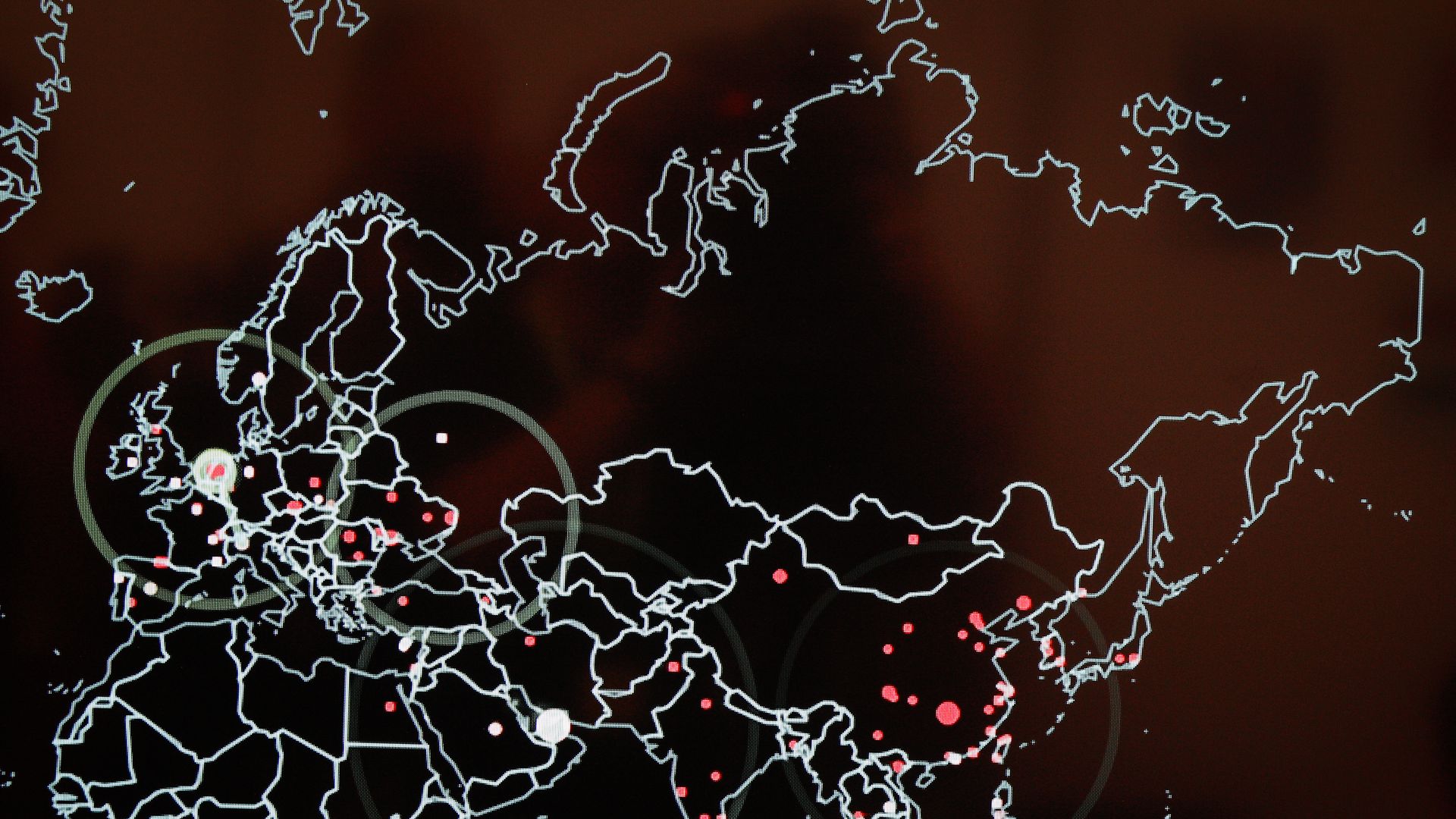 Map showing red pinpoints at certain cities around the world