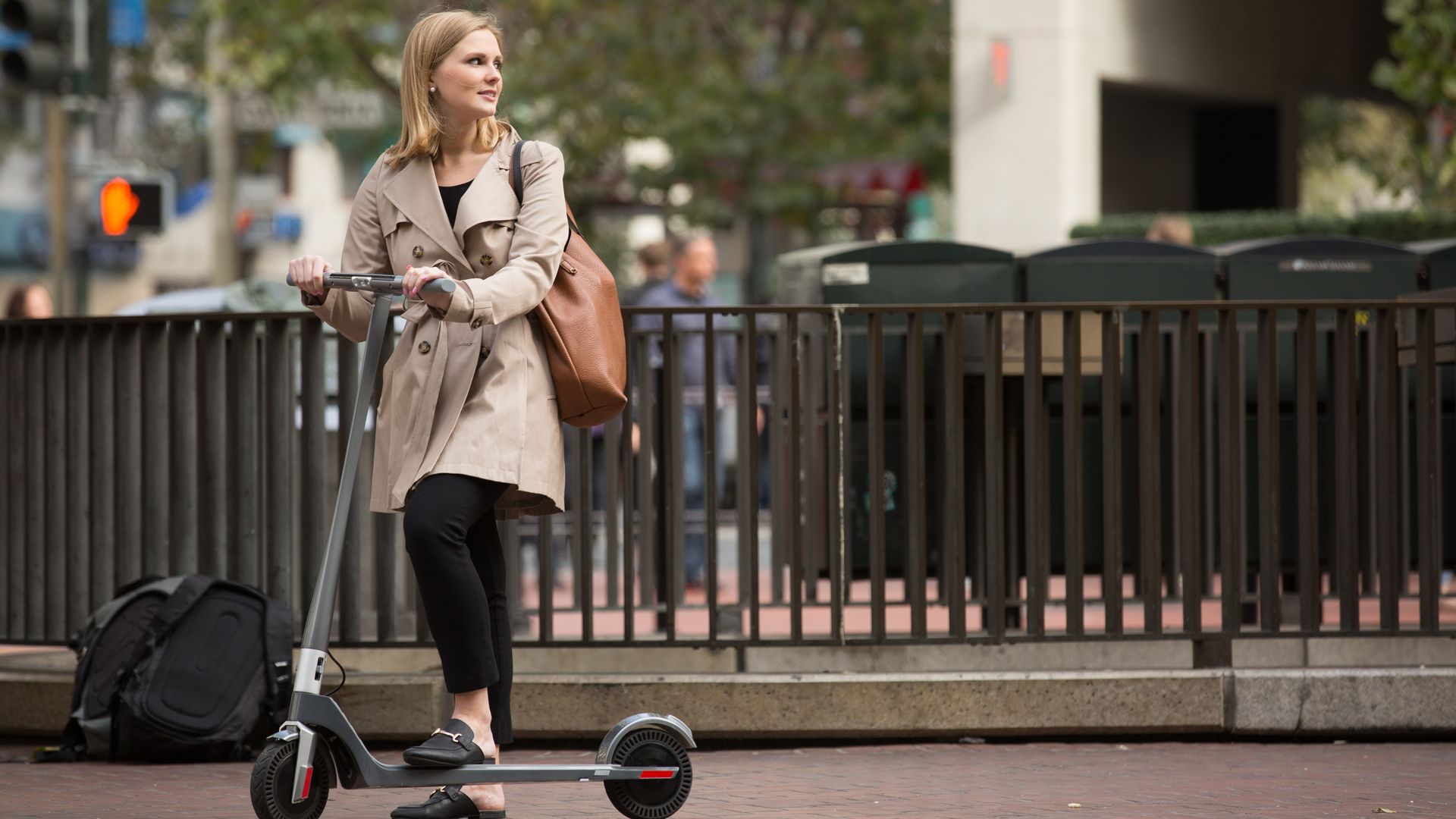 woman riding scooter
