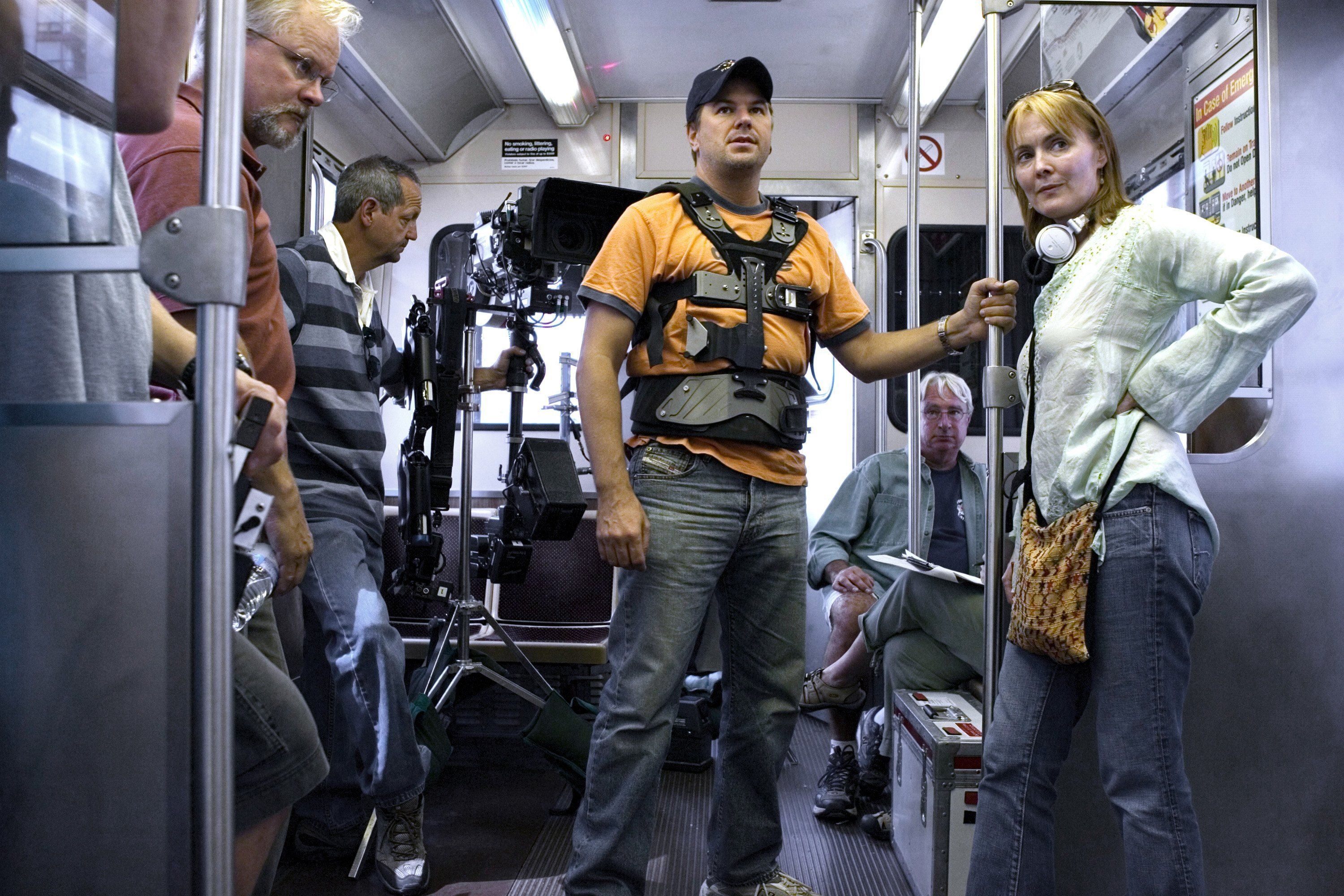 Staffers stand in a subway car ready to shoot a scene from ER