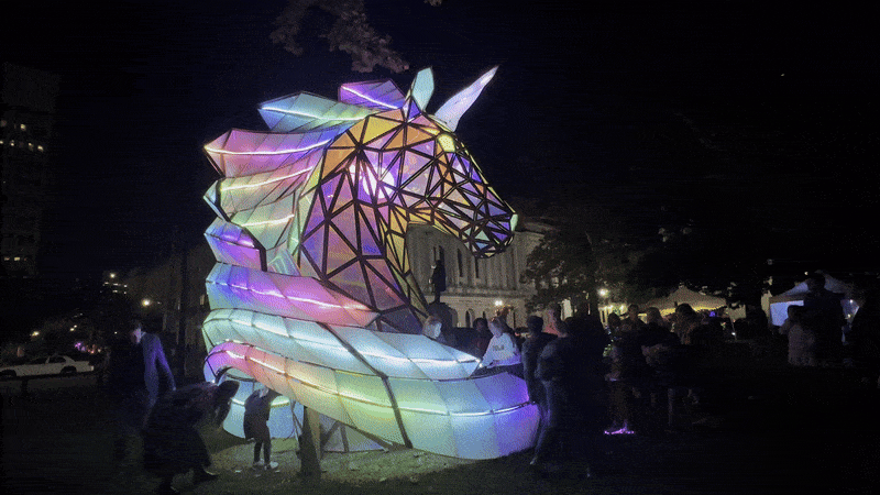 Image shows a giant rainbow unicorn head